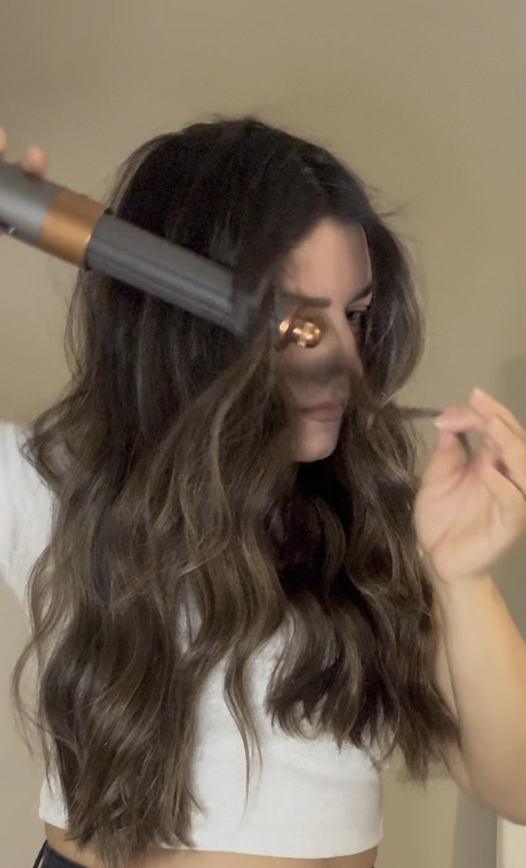 How I get BEACH WAVES with my @dysonhair airwrap:
-dry hair 80% 
-apply @colorwowhair XL bombshell volumizer before styling 
-section hair, turn on airwrap and use 1.2 barrel as a wand, wrapping small sections around the barrel while it’s on
-make sure your sections are small enough that the air is able to dry the hair fully
-when wrapping, leave out an inch on the ends so they’re straight which will give more of that beach look
-for fringe, switch to 1.6 barrel and wrap leaving more space on wand in between sections 
-finish with @oribe dry texturizing spray 
.
.
.
@dysonusa @dyson @dysonhairpro @oribe @colorwowhair @hm #hairtutorial #hairtutorials #hairtutorialsvideos #hairstyle #hairstyles #dyson #dysonhair #dysonairwrap #mydyson #airwrap #airwrapdyson #airwraptutorial #beachwaves #beachwaveshair #dysonwaves #blowout #blowoutstyles #blowoutstyles #bouncyhair #bouncyblowout #dysonairwrapcomplete #waves #waveshair #waveshairstyle #oribe #oribeobsessed #oribehair #colorwow #colorwowhair #hm

#LTKstyletip #LTKbeauty #LTKVideo