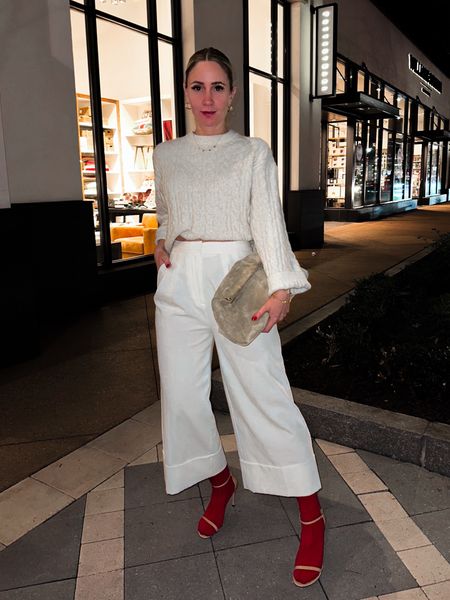 Neutral winter outfit. Cream cable knit sweater. Red socks. Suede clutch  

#LTKSeasonal #LTKover40 #LTKstyletip