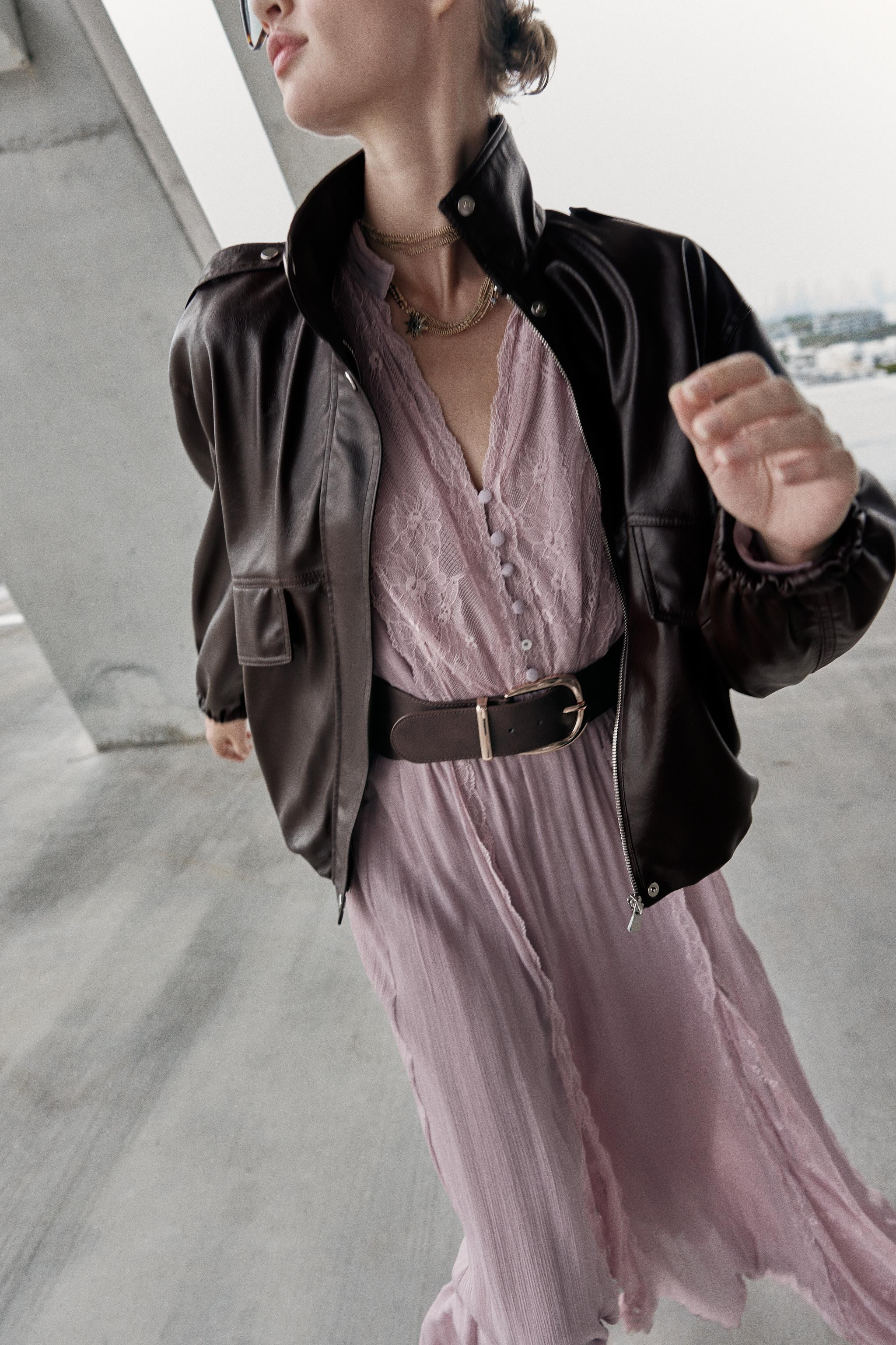 Bomber jacket with a high neck and long sleeves with shoulder tabs. Front flaps. Front welt pocke... | Zara Canada