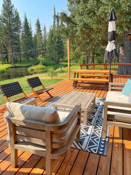 When designing for a vacation home maximize your deck space by creating zones where people can hang out.  An outdoor rug can help define your space and benches on a patio table can seat multiple kids for a BBQ.  

#LTKSeasonal #LTKhome #LTKFind