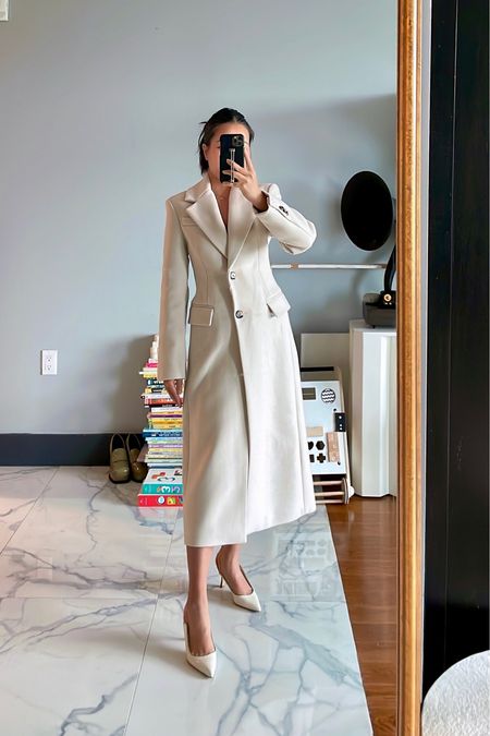 Favorite fall winter coat. 

For size reference, I’m 5 ft 105 pounds and wearing an XXS. The coat is perfect at the waist and hits at mid calf without feeling overwhelming. The length is great with heels and sneakers.