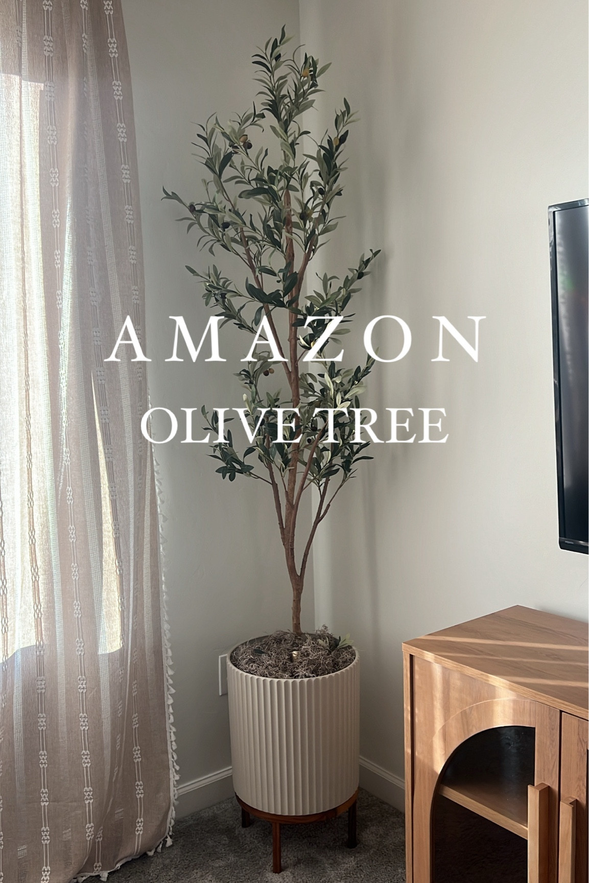 Amazon Realistic Olive Tree / I looked at every artificial tree on Amazon and this is BY FAR THE BEST ONE! I got the 6ft one! And fluted planter is beautiful! 

#LTKSaleAlert #LTKFindsUnder50 #LTKHome
