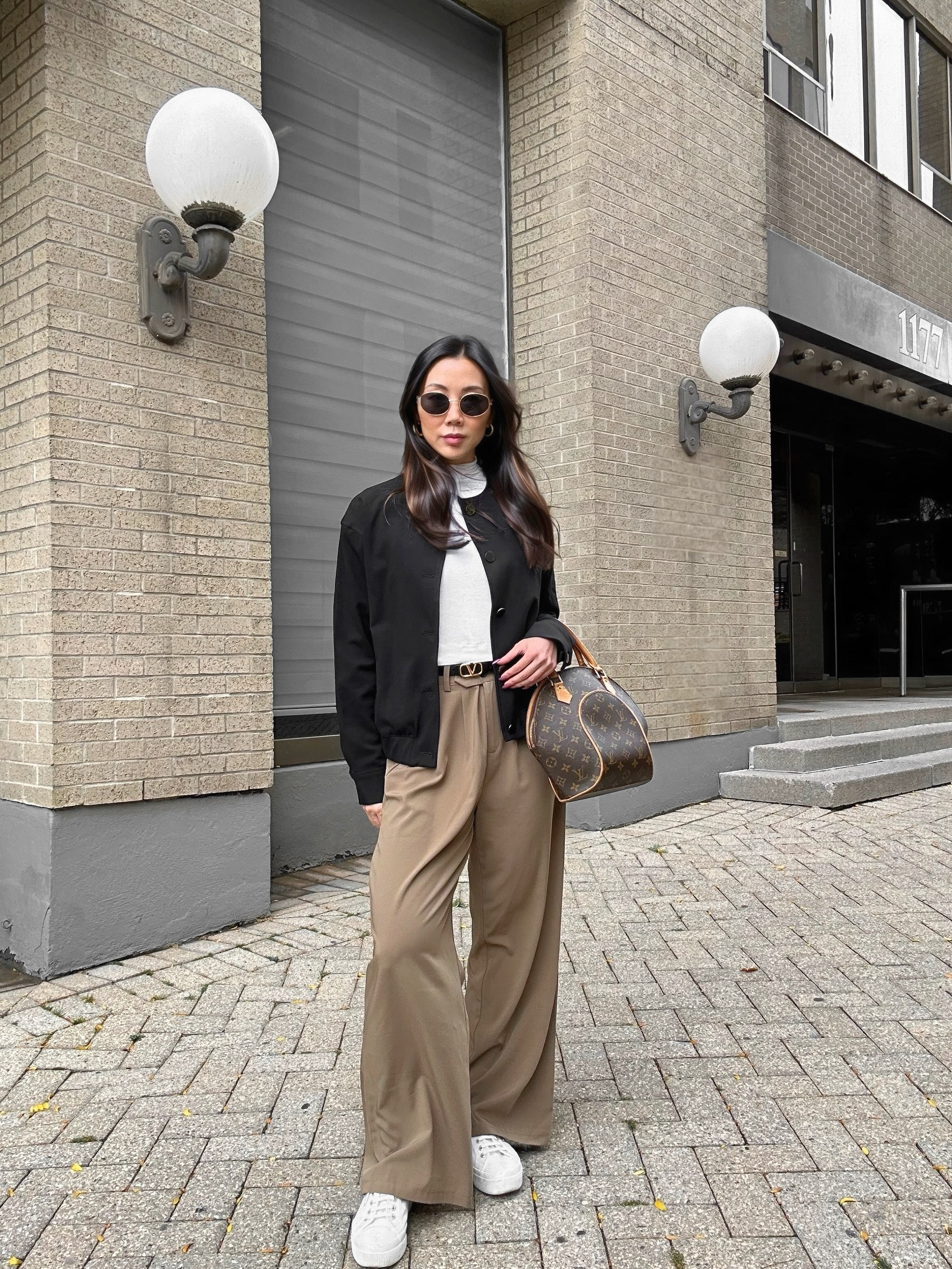 Casual fall winter outfit idea!  🍂 Styling brown trousers with a bomber jacket for an effortless everyday look. Brown pants are a seasonal must-have—versatile, chic, and a great alternative to black. Pair them with sneakers for a laid-back vibe or boots for a polished touch. Sharing more of my favorite brown trousers that are perfect for fall and winter—ideal for any capsule wardrobe! #FallFashion #BrownTrousers #CasualChic #OOTD #StyleEssentials