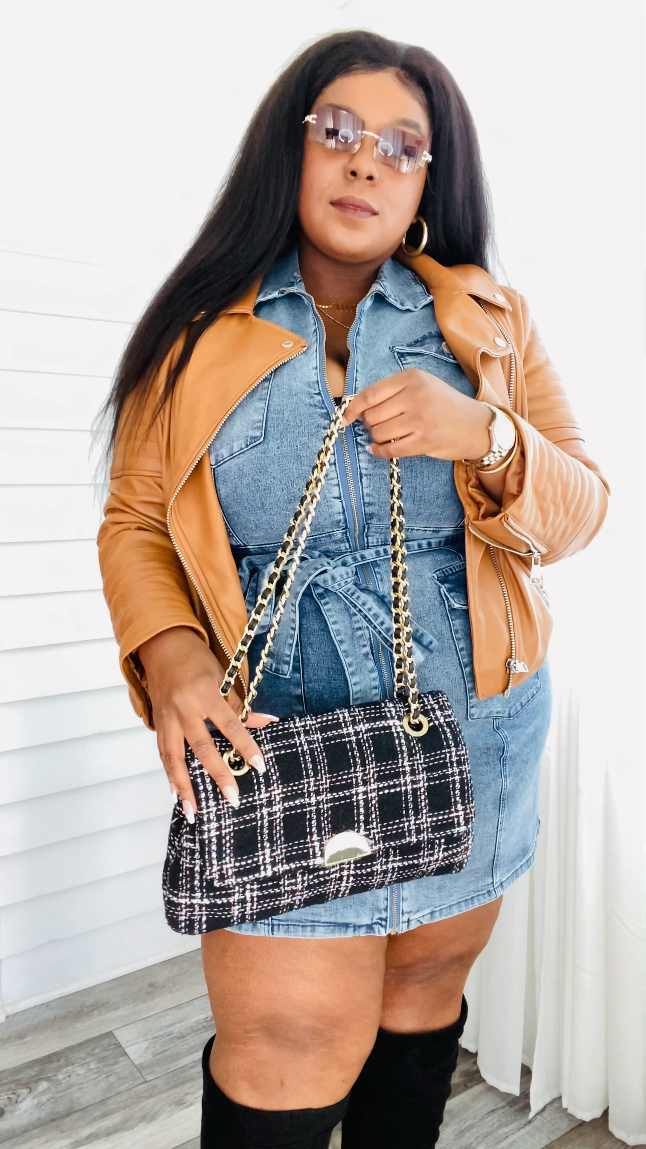 It’s Day FOURTEEN, Lous! It’s been a FUN two weeks and we are half way there! Todays look is causal but feminine. I LOVE any chance to style denim and when it’s a dress, I am pretty sure my heart races! 

The acid wash on this sleeveless denim dress from @shopcoedition is gorgeous and I couldn’t wait to get my hands on it. 

The cognac faux leather jacket is from @diaandco and it really brings and autumn vibe to the look. 🍂

Lastly the boots are wide calve friendly from @torrid and my super cute bag was a Christmas gift from my sister @rachelguthman. It really ties this entire look together! The glasses are from @amazonfashion 

Shop this look via the “LTK” link in my bio. 
How’d I do? Comment below and let’s talk style! 🫶🏽



#LTKcurves #LTKstyletip #LTKunder100