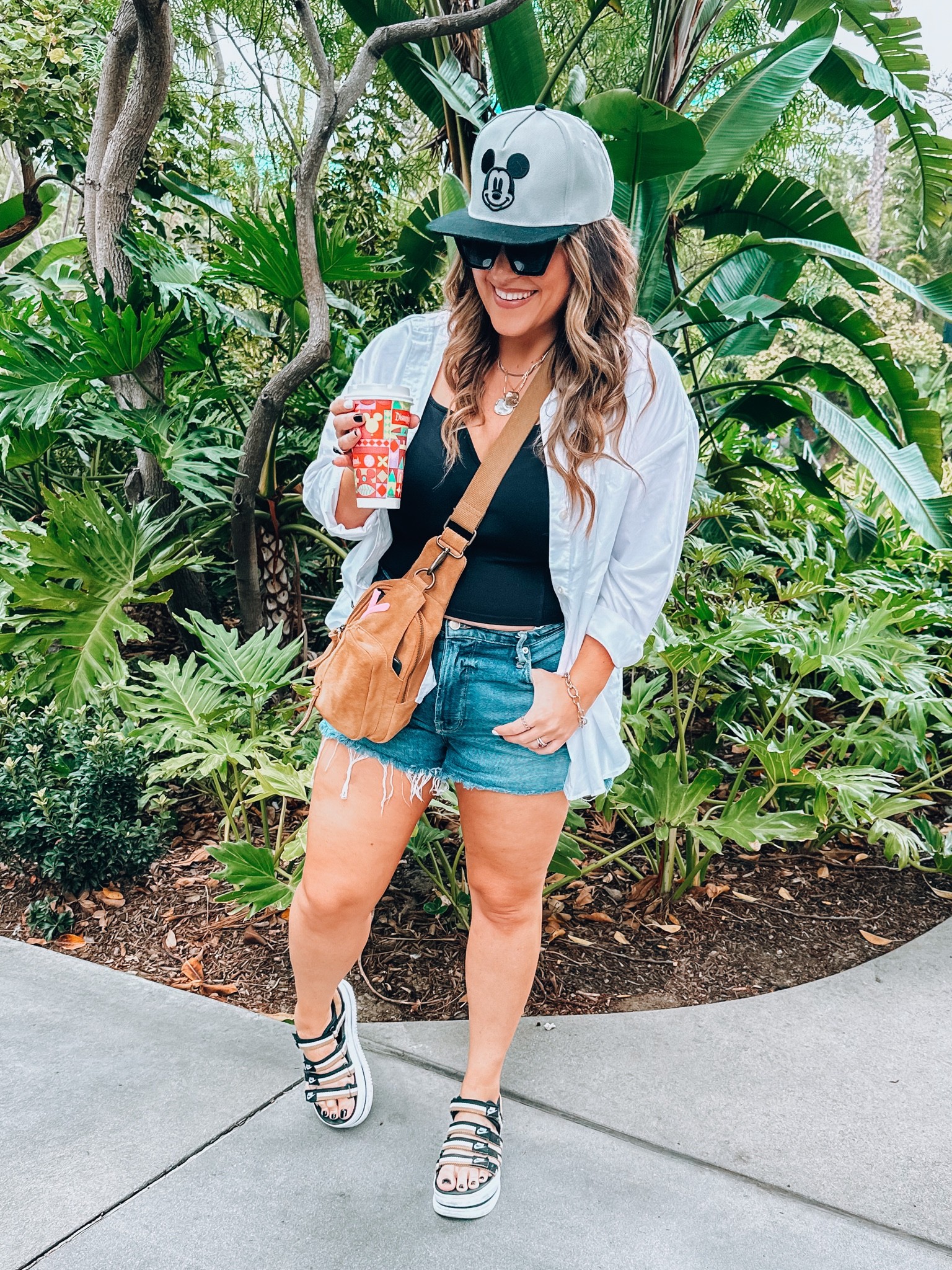 Casual midsize Disney outfit 
White button up oversized large 
Tank top large 
Jean shorts code ( 20TARYN) size 15 
Comfy walking sandal 
Sling bag 


#LTKcurves #LTKSeasonal #LTKstyletip