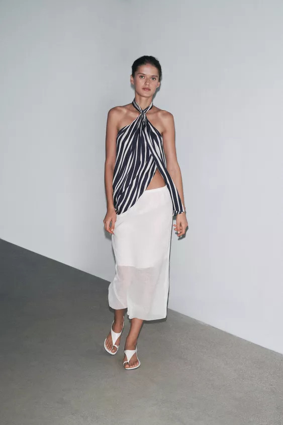 ZARA WOMAN COLLECTIONMidi skirt made of viscose yarn. Elasticated mid-rise waist. Short lining. H... | Zara UK