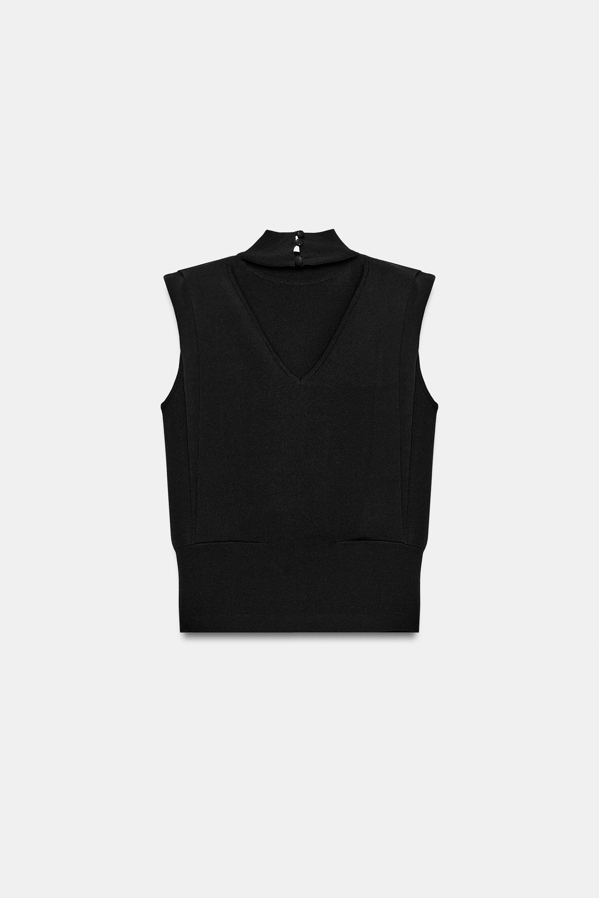 Sleeveless top featuring a high neck, shoulder pads and pleat details. Open back with button fast... | Zara UK