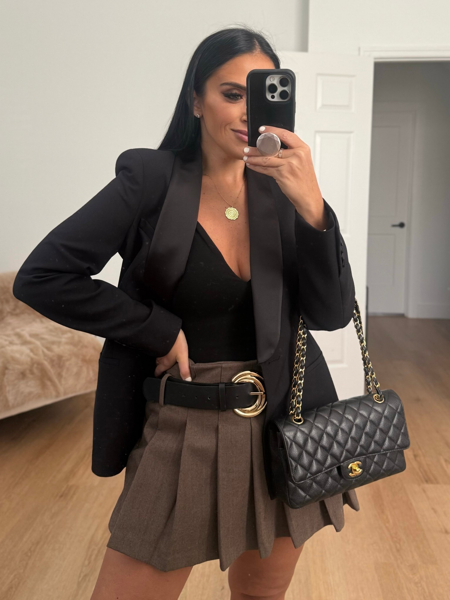 Tailored Tuxedo Blazer wearing size medium. Seamless Halter bodysuit wearing size XS/S Pleated belted skort wearing size large. 