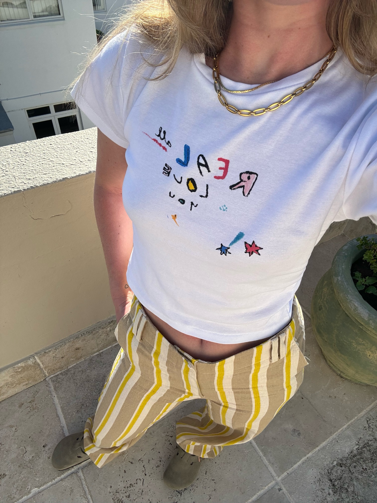 Stripped trousers, baby tee, graphic T-shirt, Birkenstock Boston clogs, spring outfit, holiday outfit, summer, casual outfit, UK fashion, realisation par, Zara 

#LTKstyletip #LTKeurope