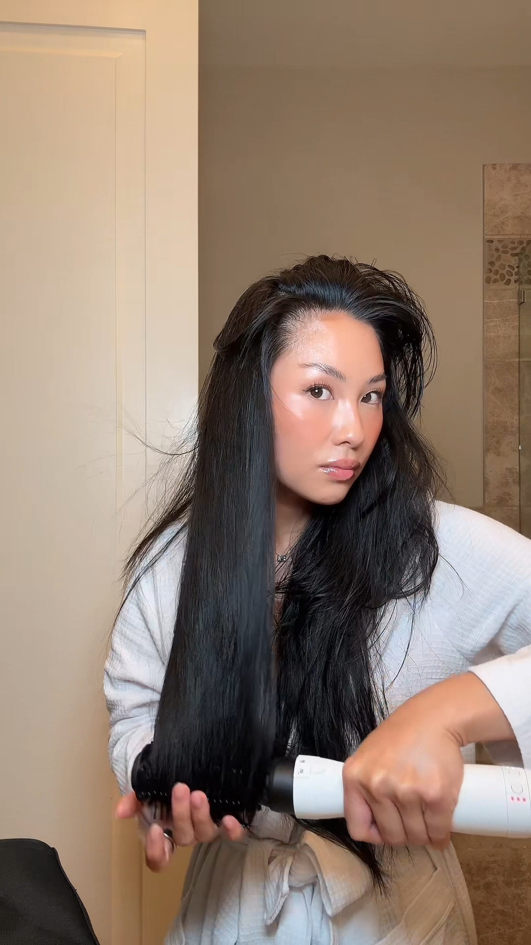 Trying out a new hair tool that is super similar to my dyson. I found that I got the same look but the tool is set up completely different (which that took getting used to). The buttons for the tool is at the bottom which I found I had to use both hands to switch off / change temp where as the dyson the buttons are right in the center which makes it more convenient. This tool comes with less attachments, but I found that it gave the same look as my dyson. Using the tool upside down is what I found worked best for me. Can you tell a difference? 

#LTKBeauty #LTKFindsUnder100 #LTKStyleTip