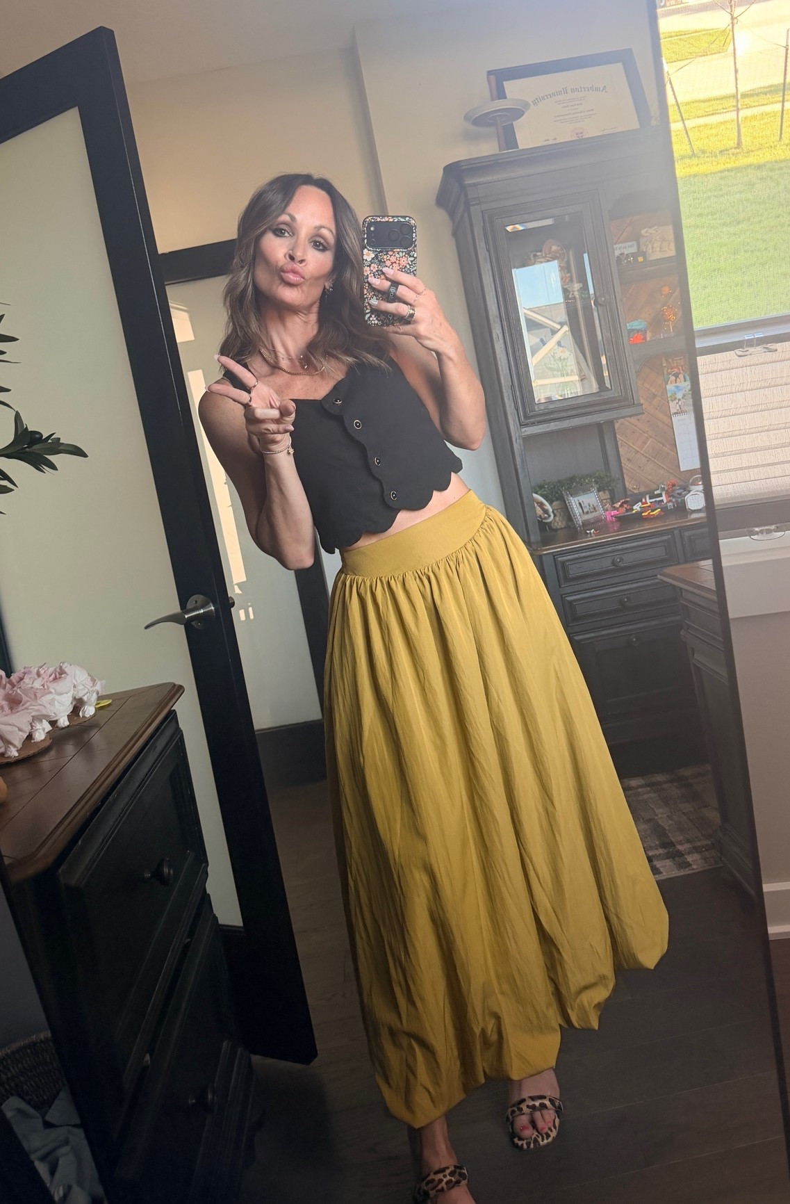 Cutest skirt ever. Highway, wasted, comes in multiple colors, stretching in the back with elastic and the most fun bubble him. It is a maxi, but more of like a midi skirt in a lot of ways because it is not fully to the floor. This can easily be dressed up or down, I wore it with friends to drink some wine this weekend. I will try to link this tank, but it is old. If not, there are so many good cropped style tanks that pair perfectly with this.

#LTKOver40 #LTKSeasonal #LTKselfcare