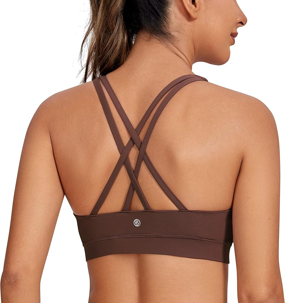 CRZ YOGA Women's Strappy Sports Bras Fitness Workout Padded Yoga Bra Criss Cross Back | Amazon (US)