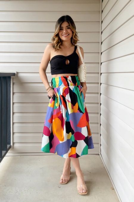 Completely obsessed with this colorful midi skirt! How cute is it?! I love how it look with this black crop top but you can also pair it with a plain crew neck tee, button down shirts, light weight sweaters, etc! The option are endless! 
Top size xs
Skirt size xs

#LTKstyletip #LTKunder50 #LTKFind
