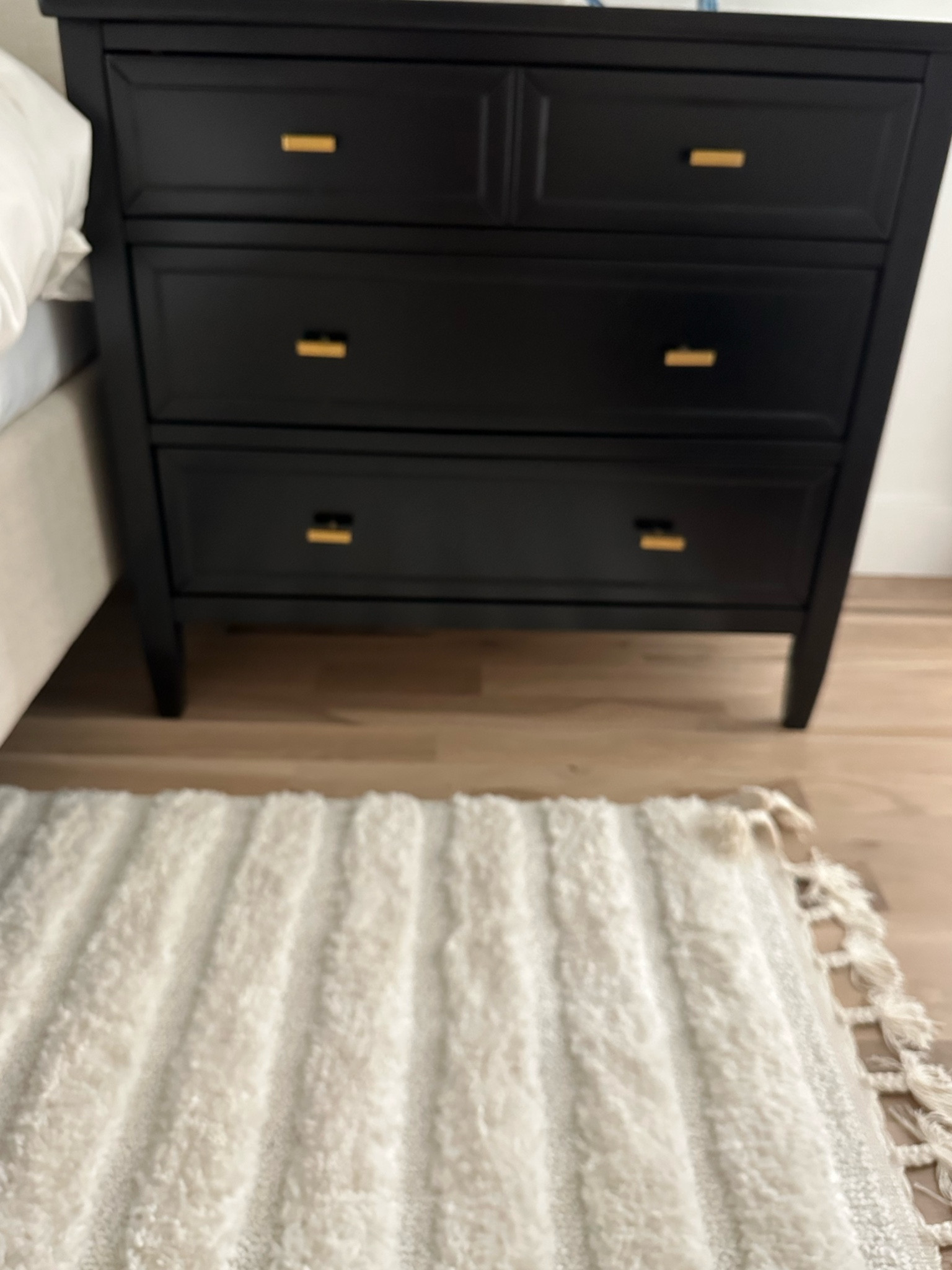Black wide dresser with gold hardware 

#LTKunder100 #LTKunder50 #LTKhome