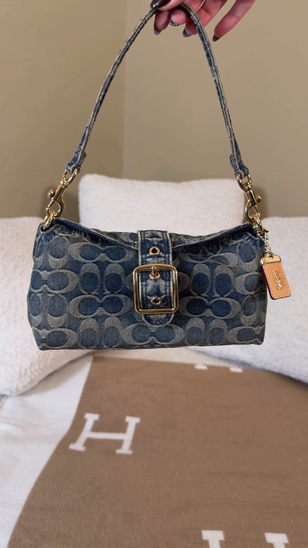 One of the coolest bags I’ve ever seen 😍 Comment SHOP & I’ll dm you the link💙

I thought about skipping the last Coach outlet drop but I’m so glad didn’t! They came out with the new Abbie shoulder bag and I am obsessed! It’s almost like a little pouch that rolls to close then can me turned into a crossbody bag or shoulder bag or even be carried as a little clutch. I got the regenerative cotton denim pattern which has a distressed look and is giving major y2k vibes!

I also love that it has the vintage style coach tag!