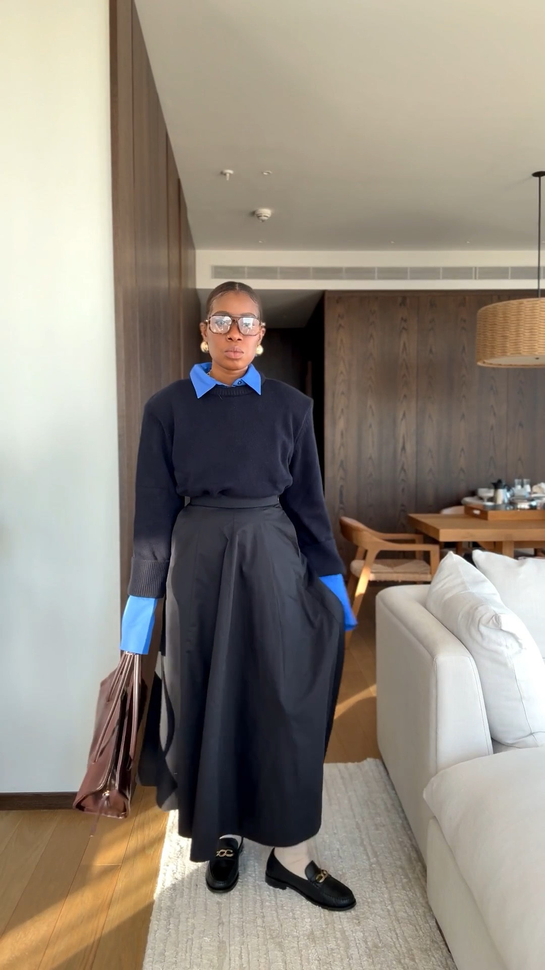 My outfit of the day long maxi skirt blue button down wool sweater and black loafers 

#LTKootd