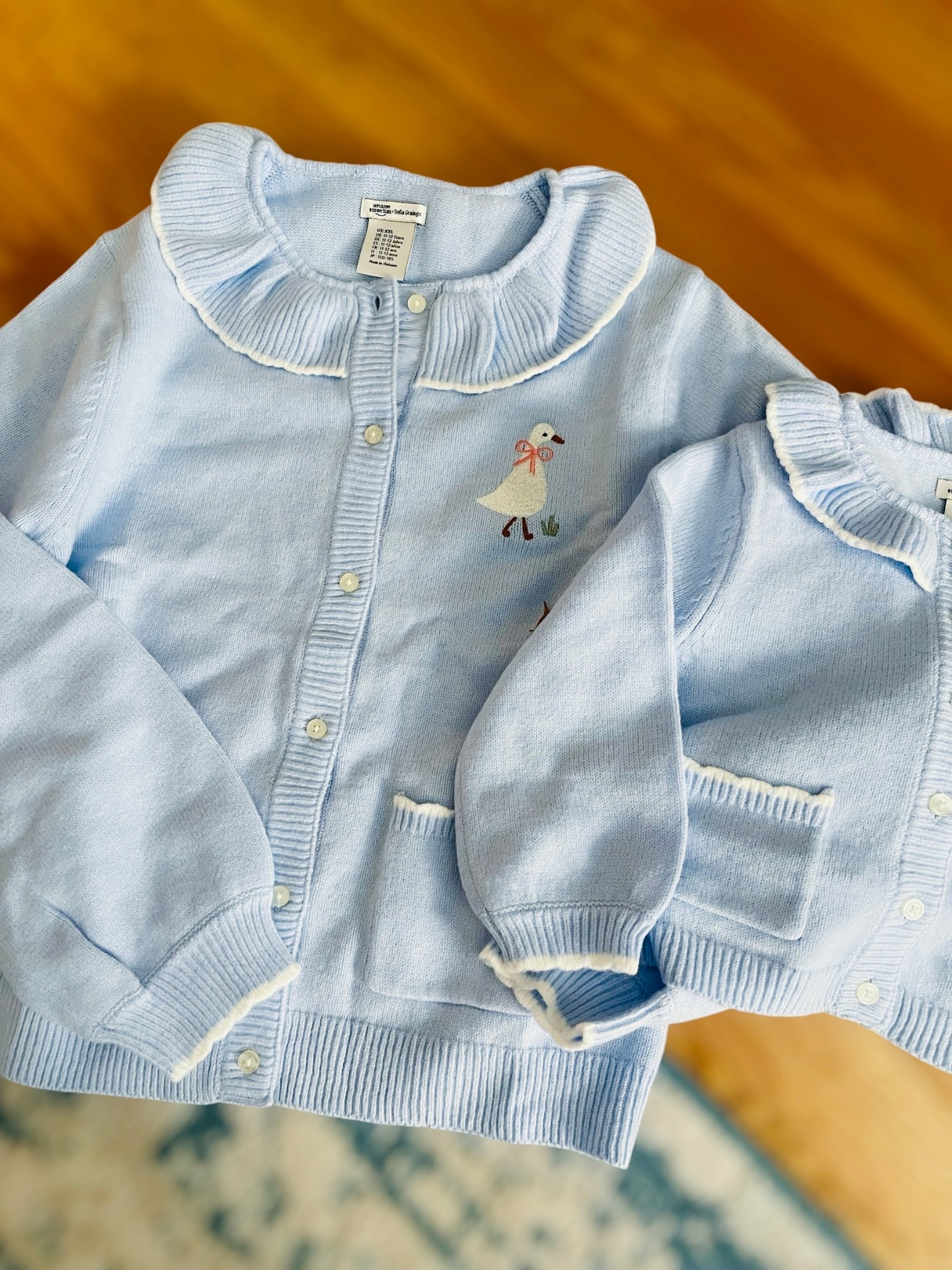 Matching Goose Cardigans 🪿💙

How precious are these little matching goose cardigans?! I grabbed the kids’ XXL for myself and the toddler size for Caroline so we could twin — and they fit perfectly. The ruffled collar, the scalloped trim, and the tiny embroidered goose with a bow… absolutely darling! Such a cute winter layer for school, errands, or holiday outings together 💙❄️

Linking all sizes since they come in toddler, little girls, big girls, and even the XXL that works for adults!

goose cardigan, mommy and me outfits, amazon matching sweaters, toddler style, girls cardigan, ruffle collar sweater, winter mom and daughter outfits, cute kids fashion, blue cardigan set, petite mom, girl mom 

#LTKmomlife #LTKBaby #LTKKids