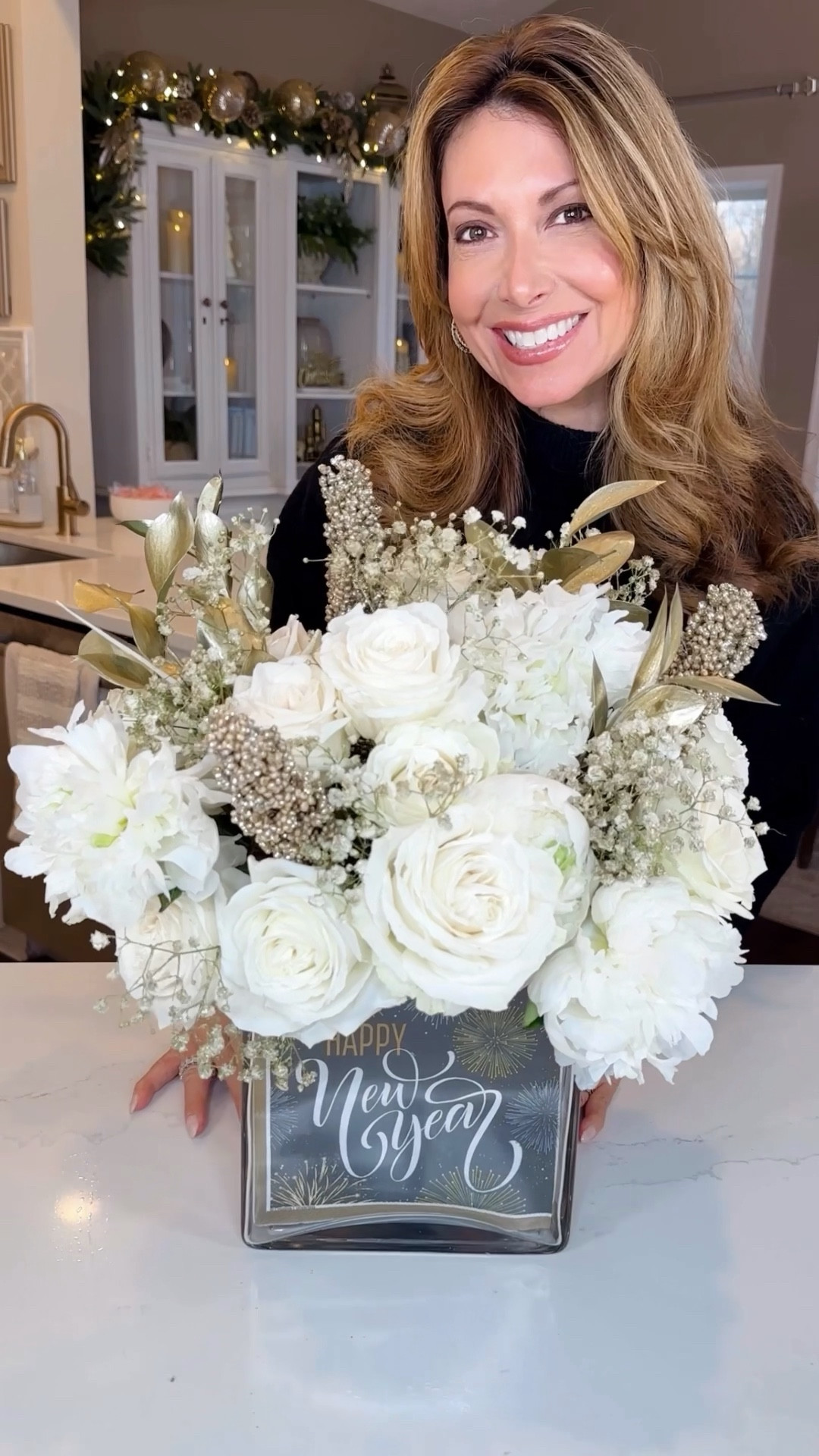 New Year’s Floral Arrangement ✨ 🍾Achieve a professional floral designer look with a printed paper dinner napkins and store bought flowers to create a festive and stylish bouquet, perfect for ushering in the new year with flair.

This arrangement would make for a perfect hostess gift, NYE gathering centerpiece or New Year birthday present.

I love to create themed floral arrangements by pairing printed napkins to convey a holiday, special occasion, or the changing seasons, all while complementing the display with carefully chosen flowers.

Using the popular tape grid method with my smaller interior vase, I arranged white peonies and roses, gold glitter sprayed baby’s breath and gold, encrusted, dried berry picks - into a sophisticated arrangement. No more slouchy flowers!

#LTKHoliday #LTKparties #LTKGiftGuide