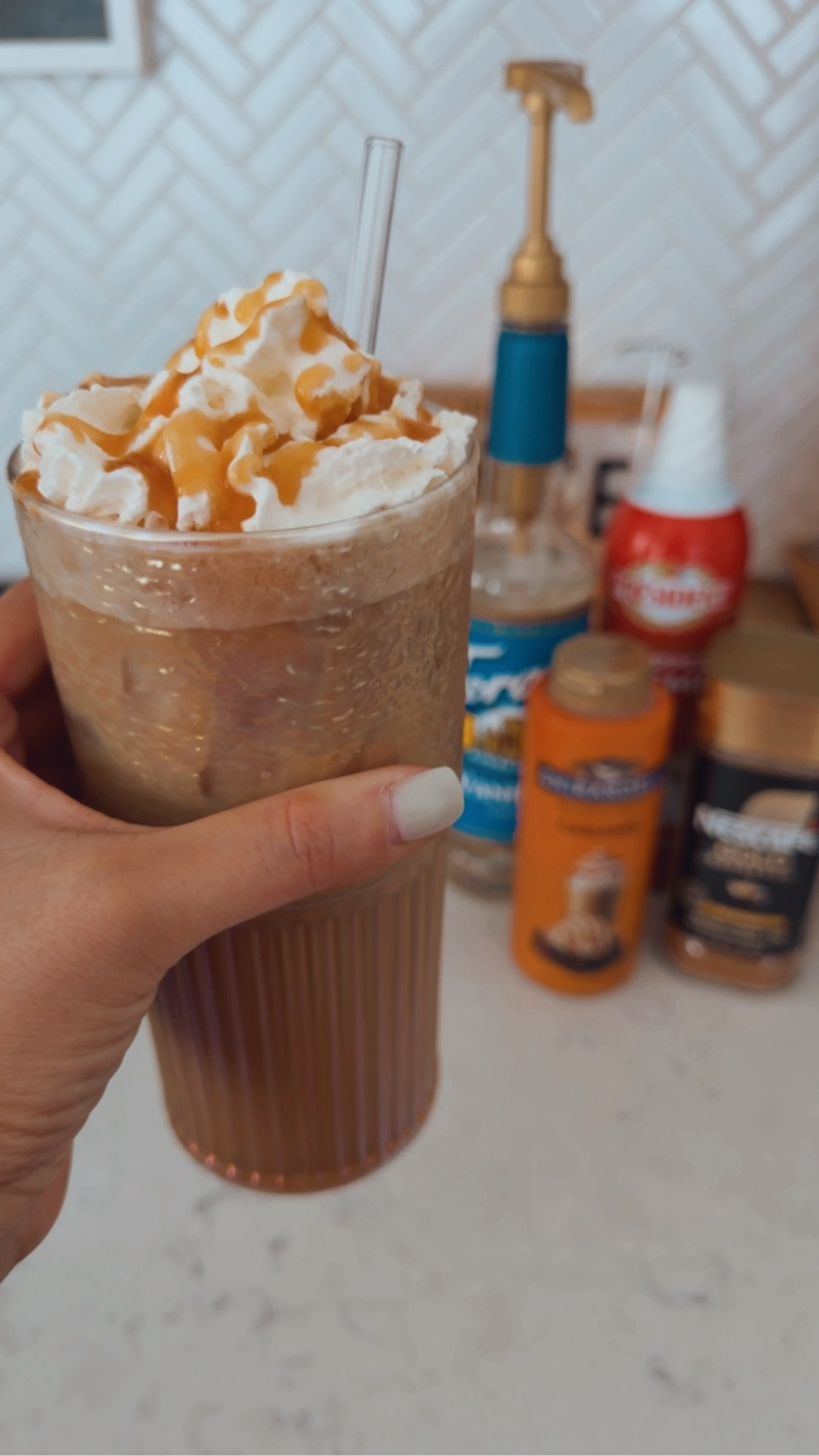 My daily iced coffee that honestly tastes better than the drive-thru ☕️

Super easy and takes 2 minutes.

Recipe:
• 2 tsp instant espresso
• ½ cup cool or warm water
• 1 tbsp vanilla syrup
• 1 tbsp caramel sauce
• Ice
• Milk or half & half

How I make it:
1️⃣ Mix espresso + water
2️⃣ Add vanilla syrup + caramel
3️⃣ Froth or mix well
4️⃣ Fill cup with lots of ice
5️⃣ Top with milk or half & half
6️⃣ Stir + top with whipped cream and drizzle caramel if you’re feeling extra

WFH mom tip: make it in a cute glass and pretend you’re at a coffee shop for 5 minutes. ☕️✨

#LTKselfcare #LTKdayinmylife #LTKmomlife