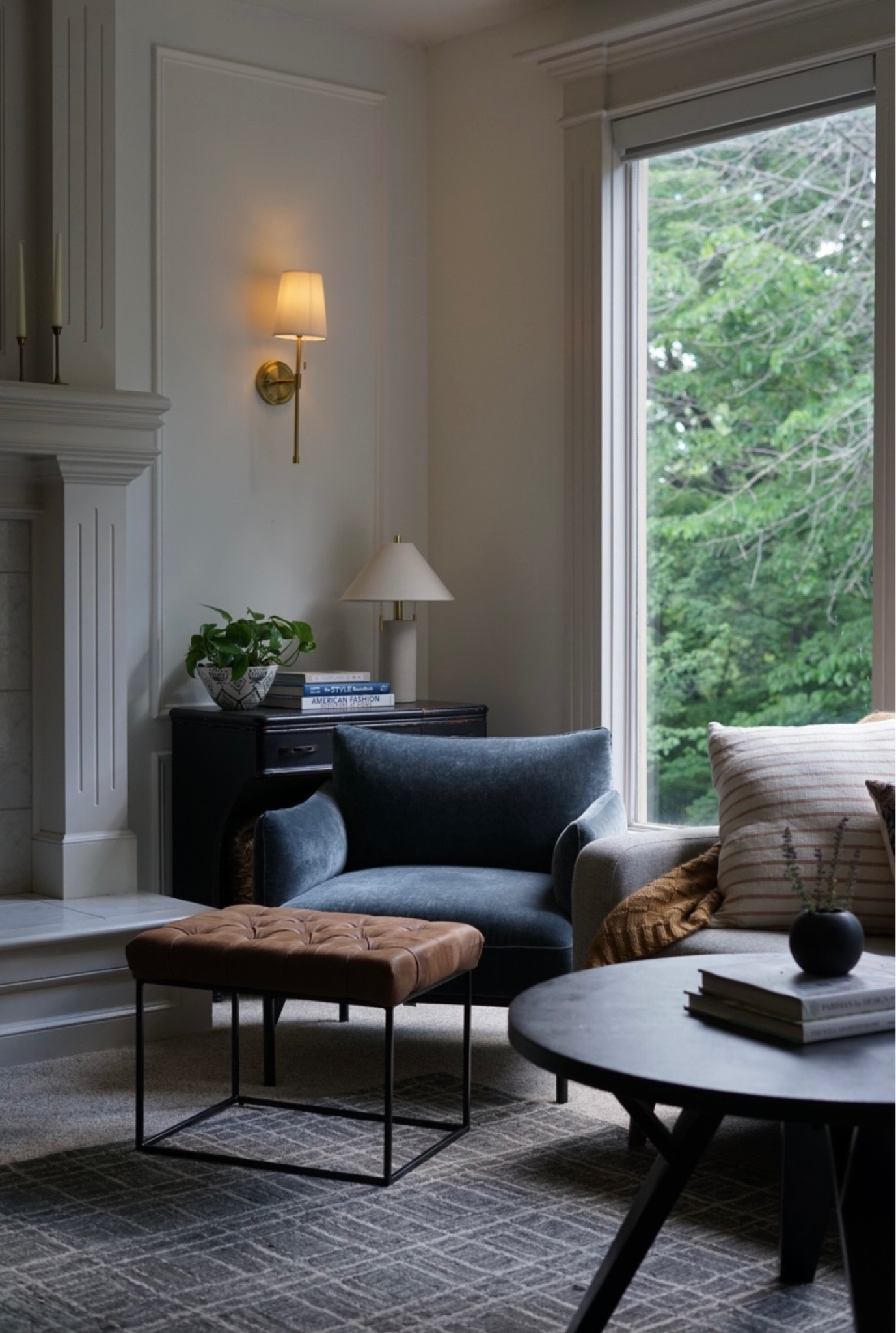 Modern living room with blue accent chairs, target decor and pull cord wall sconces. 

#LTKHome