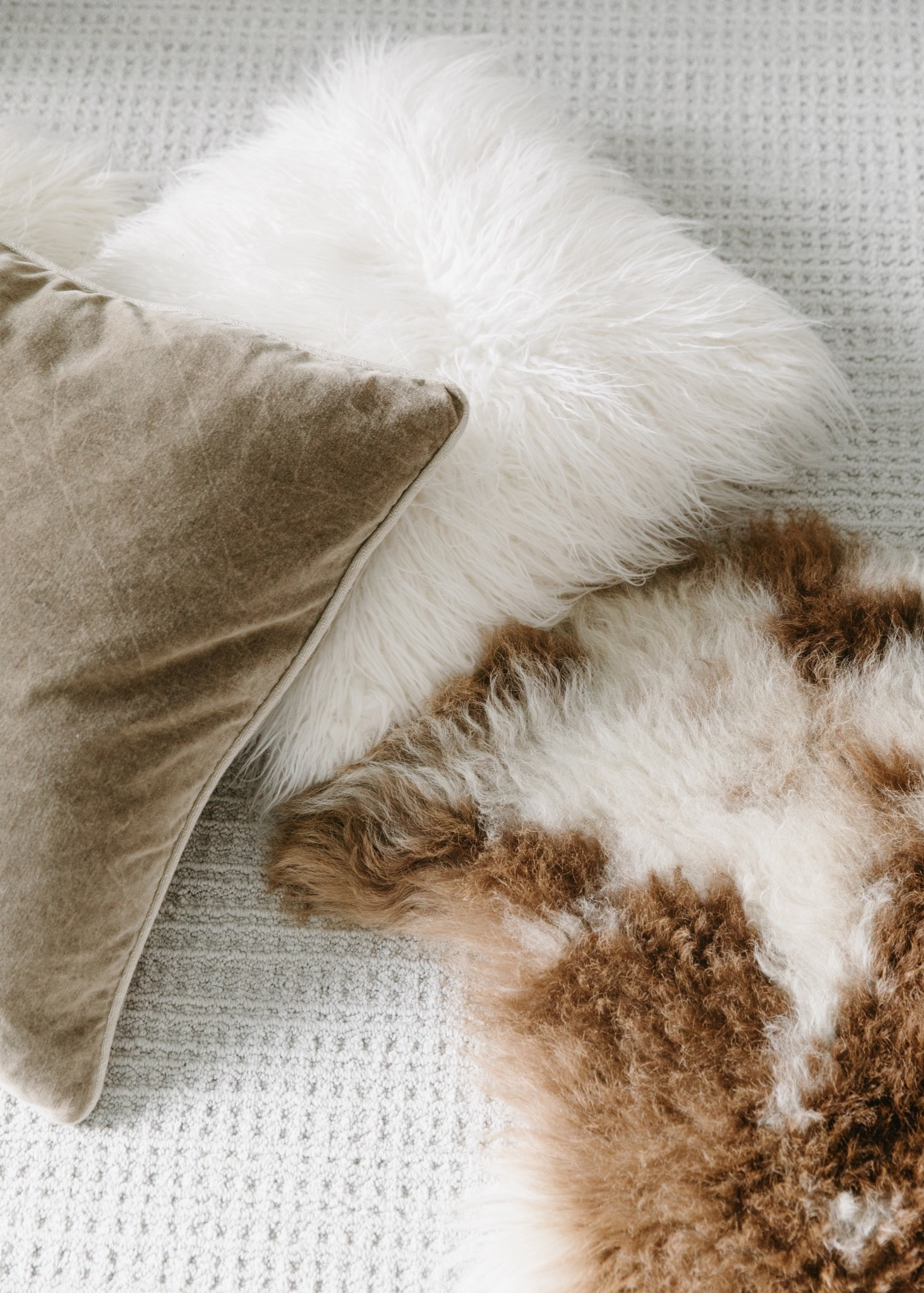 Linking similar items. This is a sheepskin rug, faux fur square pillow, and a velvet pillow that was discontinued.

#LTKspring #LTKHome #LTKdayinmylife