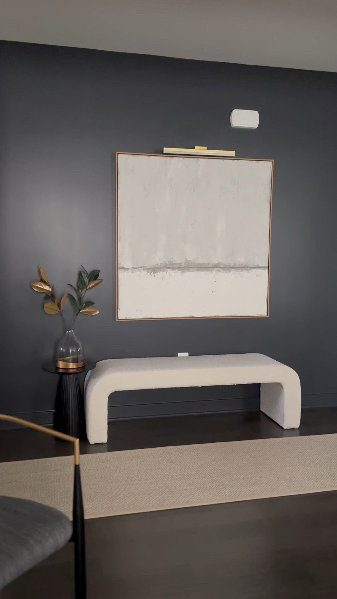 This pass-through space got a moody upgrade and became a functional seating area with a boucle bench, statement art, black side table, and wireless picture light. 🤗❤️

#LTKSaleAlert #LTKHome