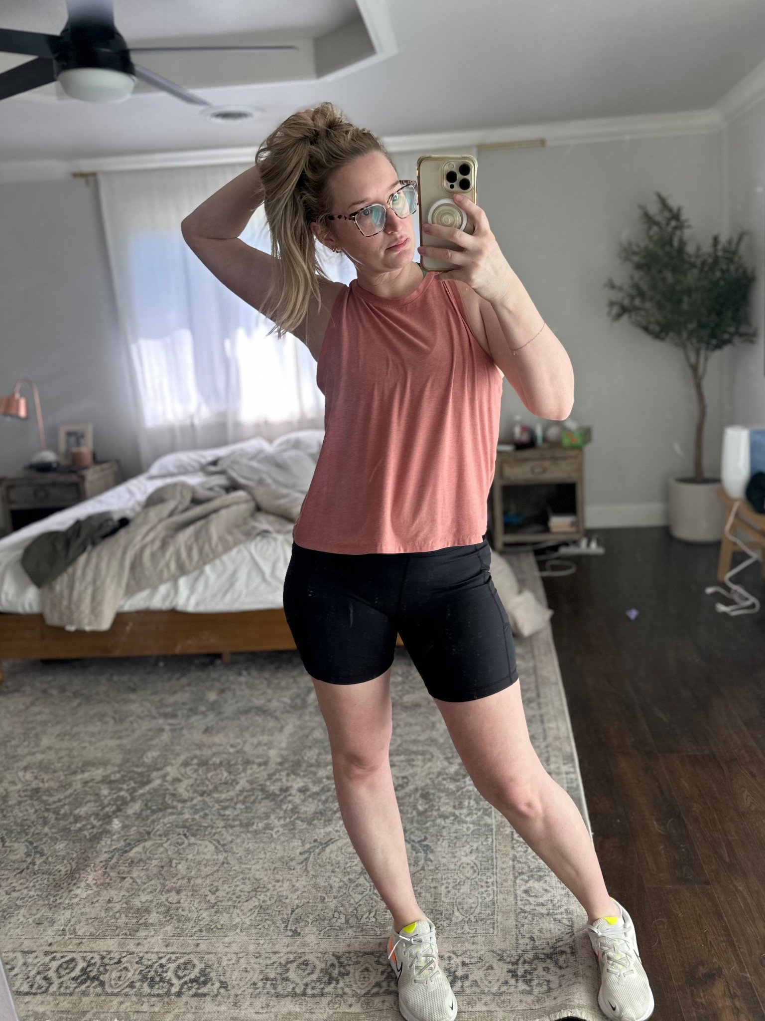 The very best mid size workout tank top. I’ve had this for YEARS and it washes so well and the drape of it is unmatched. The length is not too short not too long. I’m obsessed

Workout outfit, bike shorts, Nike tennis shoes, tank, mom fit