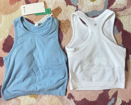 Great tank / sports bra combo! White is see-through on the bottom half. Size down. 