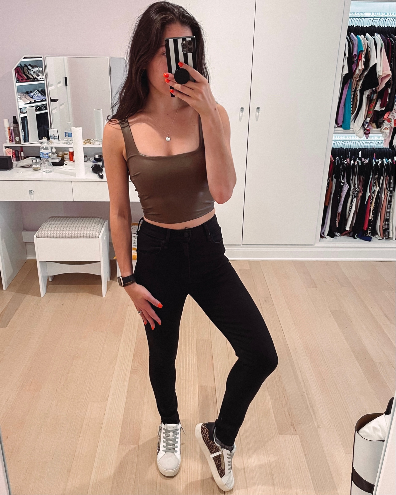 Faux leather cropped tank under $50 at express in a pretty brown. Perfect for fall layering. Paired with black high waisted jeans and leopard sneakers. 

#LTKSeasonal #LTKstyletip #LTKunder50