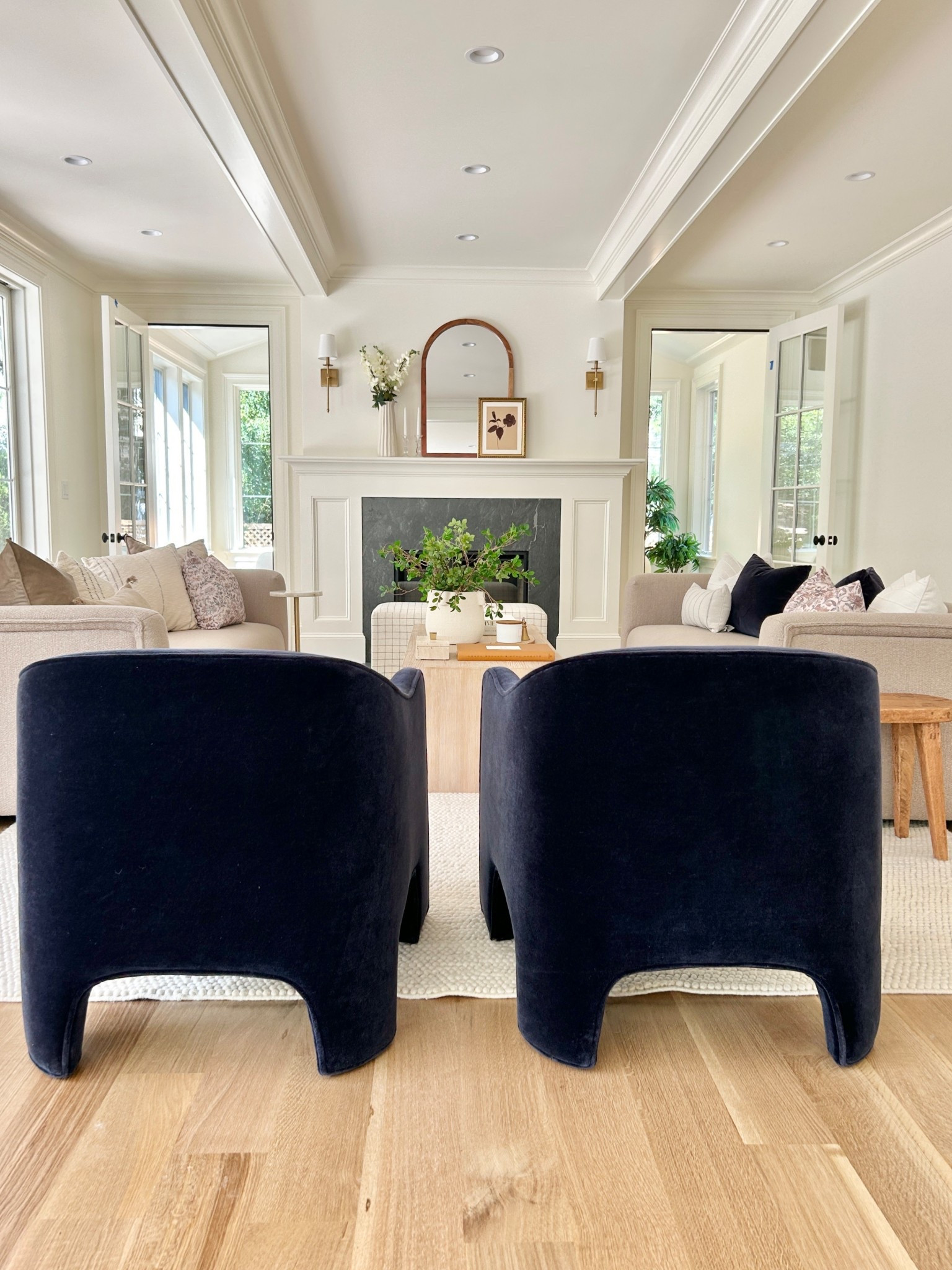 Curated neutral living room with navy chairs and tan sofas.  

#navychairs #livingroom

#LTKHome