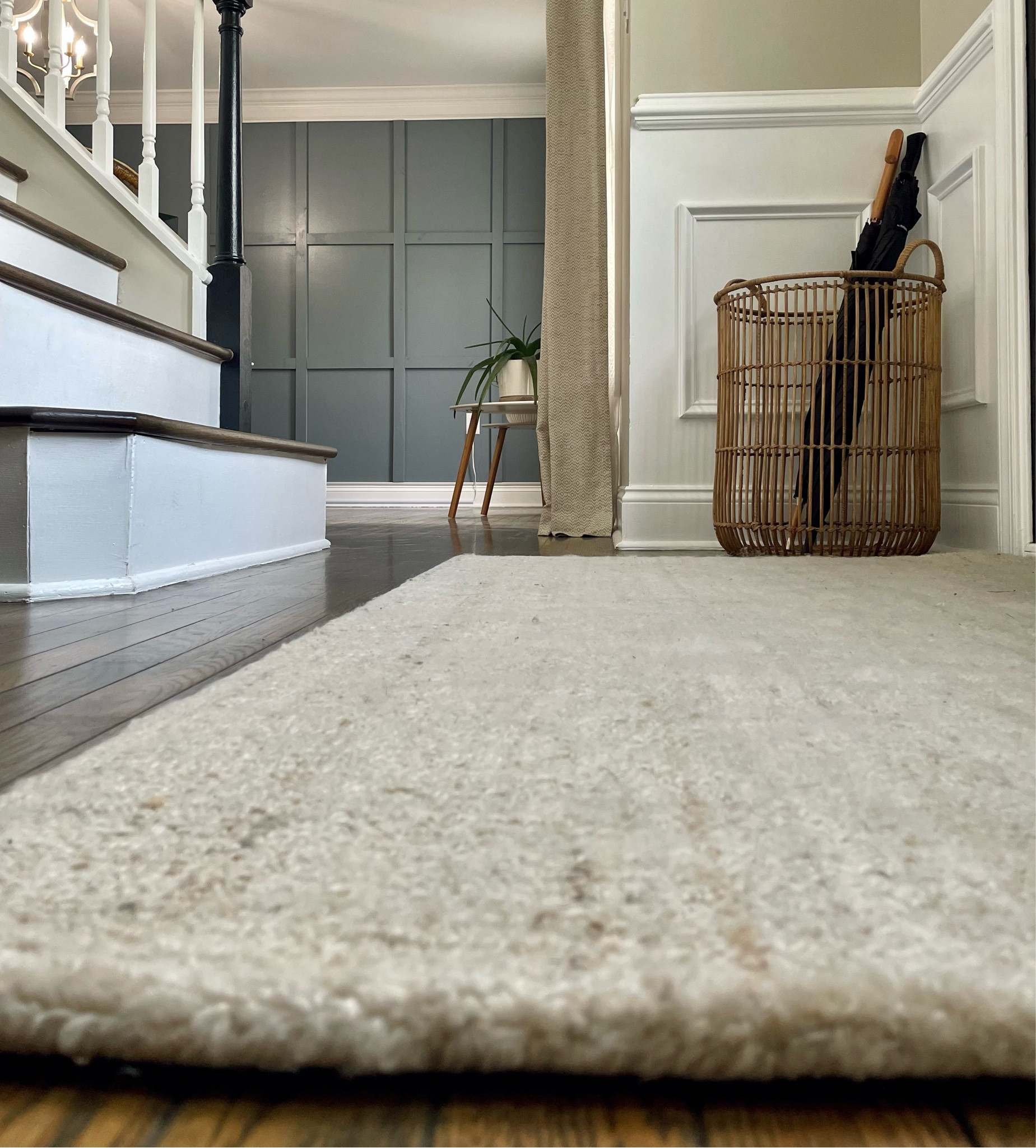 Modern Farmhouse entryway ✨

Rattan wire basket for umbrella storage,  entry rug, board and batten wall 🤍

The umbrellas are from Staples! One is an adorable black umbrella with  wooden handle. 