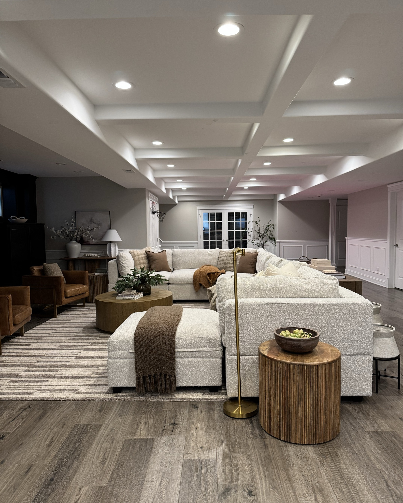 Our cozy basement! I added a lot of browns, tans and wood tones to warm up this space! I love our fireplace here so much but if you don’t have a built in one you can always add an electric one for that cozy feel.

#wayfair #basement #fireplace #arearug #neutralhome #sectionalsofa #albanypark #coffeetable #accentchair #sidetable #jossandmain #floorlamp #amazonhome #amazon #wayfair #boldneutrals #modernhome 

#LTKSaleAlert #LTKSeasonal #LTKHome