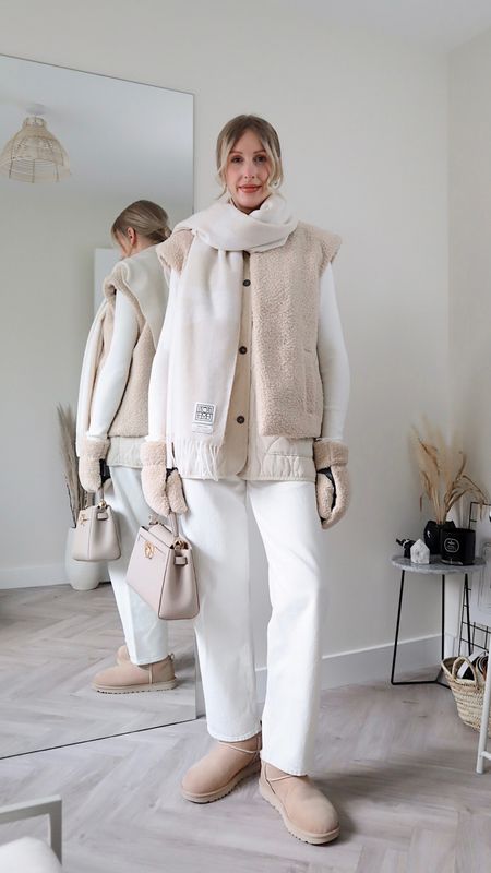 Winter whites shearling gilet outfit 🐑

- Borg gilet (M) linked black version
- AGOLDE jeans 25’ - size down
- Free People Gilet (s)
- Toteme scarf (discount code coming soon)
- Parisa Wang NYC handbag (not linked)
- Ugg ultra mini boots 
- teddy mittens (love these!)
- Mo & Co top (similar linked) 

#winterwhites #neutrals #uggboots 

#LTKstyletip #LTKSeasonal #LTKshoecrush