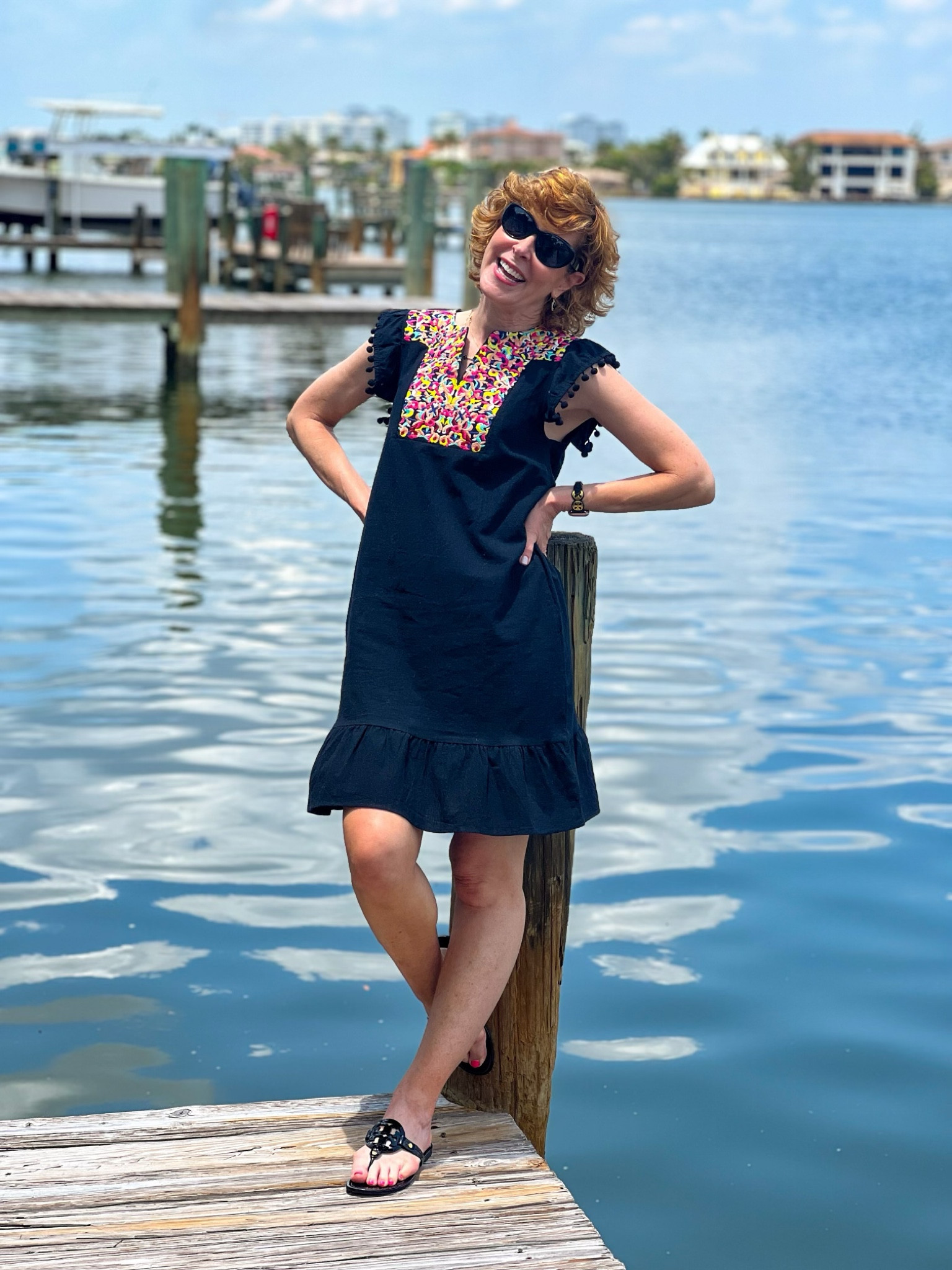 This Amazon dress is a great find! Check out the Pom Pom sleeve detailing and the colorful detailing at the neckline. I love the wide ruffle at the hemline.
It looks like linen, but it's not! + travels well and is wrinkle resistant. It fits TTS and I'm wearing my normal XS.
I paired it with classic Tory Burch patent sandals, a black Tory Burch Apple Watch band, and my favorite pair of sunnies!

#LTKstyletip #LTKunder50 #LTKtravel