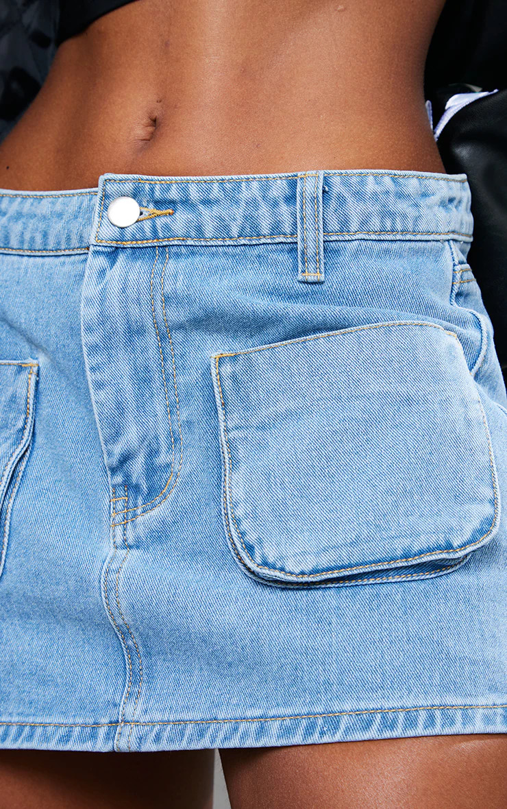 Light Blue Wash Cargo Pocket Front Denim Extreme Mini Skirt | PrettyLittleThing US