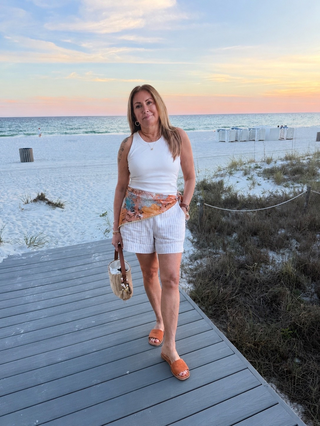 Easy coastal casual 🌴☀️
Wearing my favorite comfy basics with a little beachy twist — striped linen shorts from Banana Republic Factory, a super flattering Amazon tank with a built-in bra (so easy + comfy), and a lightweight printed scarf tied at the waist for a fun pop of color. Finished the look with simple slides for an effortless vacation vibe. 🤍

Amie Pagan, vacation looks, summer casual

#LTKootd #LTKSeasonal #LTKTravel