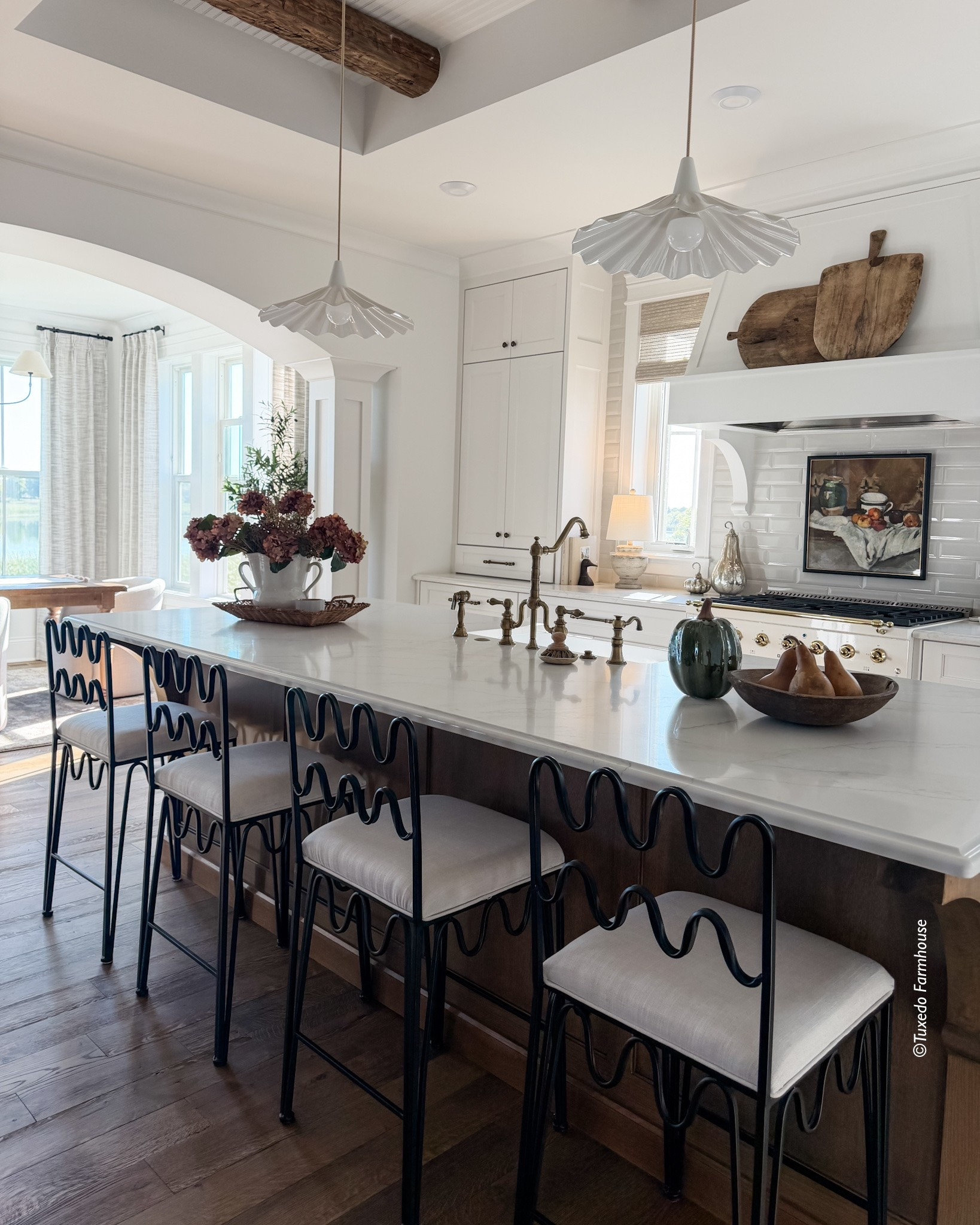 Fall has found its way into my kitchen! 🍂 Pretty florals, faux pumpkins, and a bowl filled with gourds bring in those warm, cozy touches I love this time of year. Simple seasonal layers make it feel perfectly ready for fall.

Counter stools are from Rachel Donath.

#LTKHome #LTKSeasonal #LTKStyleTip #FallKitchen #FallDecor #KitchenStyling #AutumnDecor #CozyFallHome 

 #LTKSeasonal #LTKHome #LTKSaleAlert