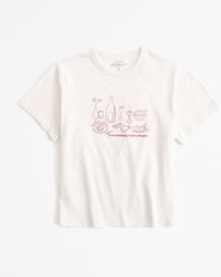 Women's Short-Sleeve Dinner Graphic Skimming Tee | Women's Tops | Abercrombie.com | Abercrombie & Fitch (US)