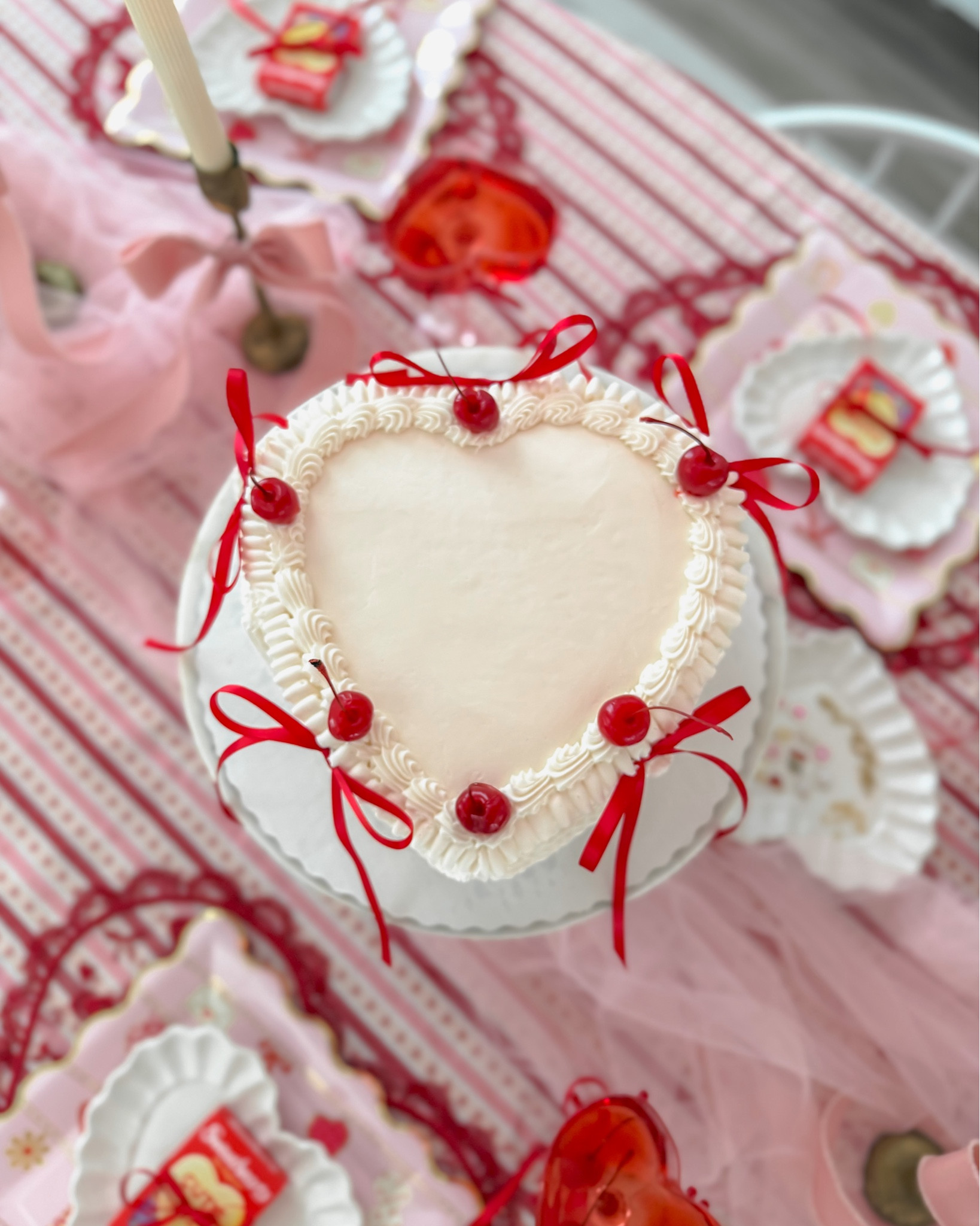 This is your sign to order a $20 Walmart vintage heart cake for your Galentine’s & Valentine’s parties!  I asked for an all white cake but you can customize the colors and embellishments.

I tied thin red ribbons and added them to the cake.  Then added cherries 🍒 and on the sides I placed heart icing decorations.  Super simple and elegant! 

#LTKfoodie #LTKHome #LTKValentine