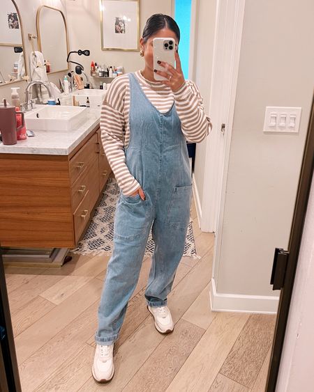 Fall outfit check! Love this oversized denim jumpsuit! So comfy and easy! Wearing a small! This striped sweater is so soft and cozy! Also wearing a small! If you need some everyday neutral sneakers, this pair is perfect! They fit TTS


#LTKxMadewell #LTKfindsunder50 #LTKSeasonal
