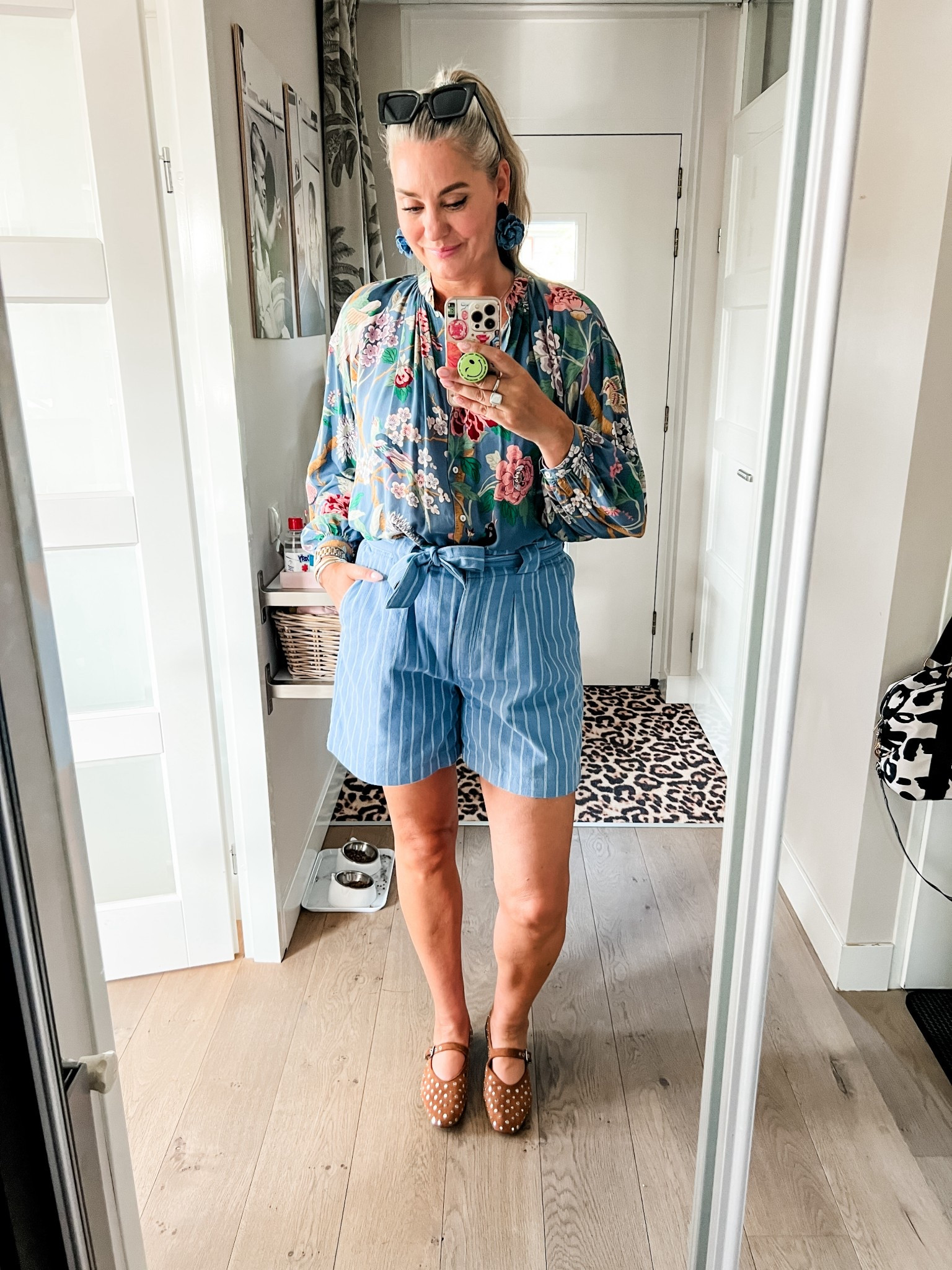 Ootd - Wednesday. Blue floral printed blouse from an old H&M collab collection (Vinted find) paired with blue striped paperbag shorts (Norah), brown studded Mary Jane flats. Earrings from Paulie Pocket (LOUS15 for discount). 



#LTKsummer #LTKnederlands #LTKeurope
