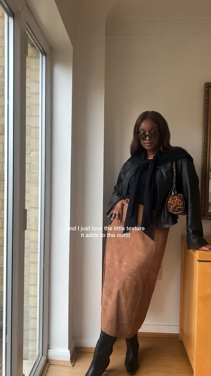 day 20/30 🖤
We’re doing celebrity lookalike outfit remakes! Of course I picked my twin….Zendaya 🙂‍↕️Jokes aside obsessed with the textures in this look and this leopard print bag from @tabithasimmons x @nextofficial was the perfect finishing touch👌🏾

skirt @sezane 
jacket @louloustudio_paris 
bag @tabithasimmons @nextofficial 
jumper @arketofficial 
boots @marksandspencerstyle 

•
•
•
•
•
•
•

•
leopard print, suede skirt , leather jacket , Autum outfit , autumn outfit ideas, minimal style, celebrity style, celebrity lookalike, knee high boots, fashion inspiration, Pinterest, daily wear, daily outfit, styling, outfit of the day

#ootd #fallfashion #autumnstyle #fallstyle #modestoutfitideas #stylingreel #fashionreels #effortlesschic #fashiontrends #falltrends #capsulewardrobe #capsulecloset #fashionhacks #minimalstyle #suedeskirt #leopardprint #leopardprints #leatherjacketseason #autumnoutfitideas