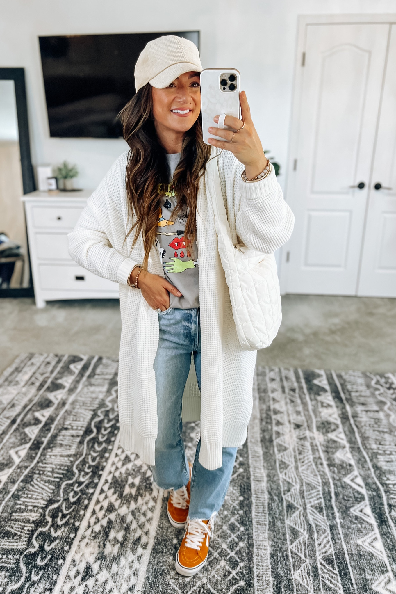 My favorite long cardigan!! Styled with this run $19 Halloween graphic! I love the comic book vibe…you could do a red beanie with the red vampire teeth, or add some turquoise jewelry to go with the blue tombstone 👍 

#LTKHalloween #LTKfindsunder50 #LTKstyletip