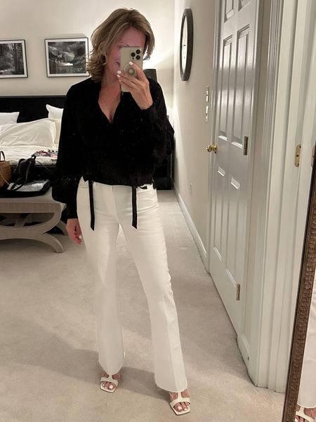 Silk blouse with tie neck and bishop sleeves. Very romantic and airy. Silk has stretch and white frayed bottom jeans compliments top beautifully 