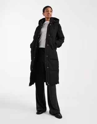 Vero Moda Tall 2-in- 1 longline puffer coat with removable sleeves in black | ASOS (Global)