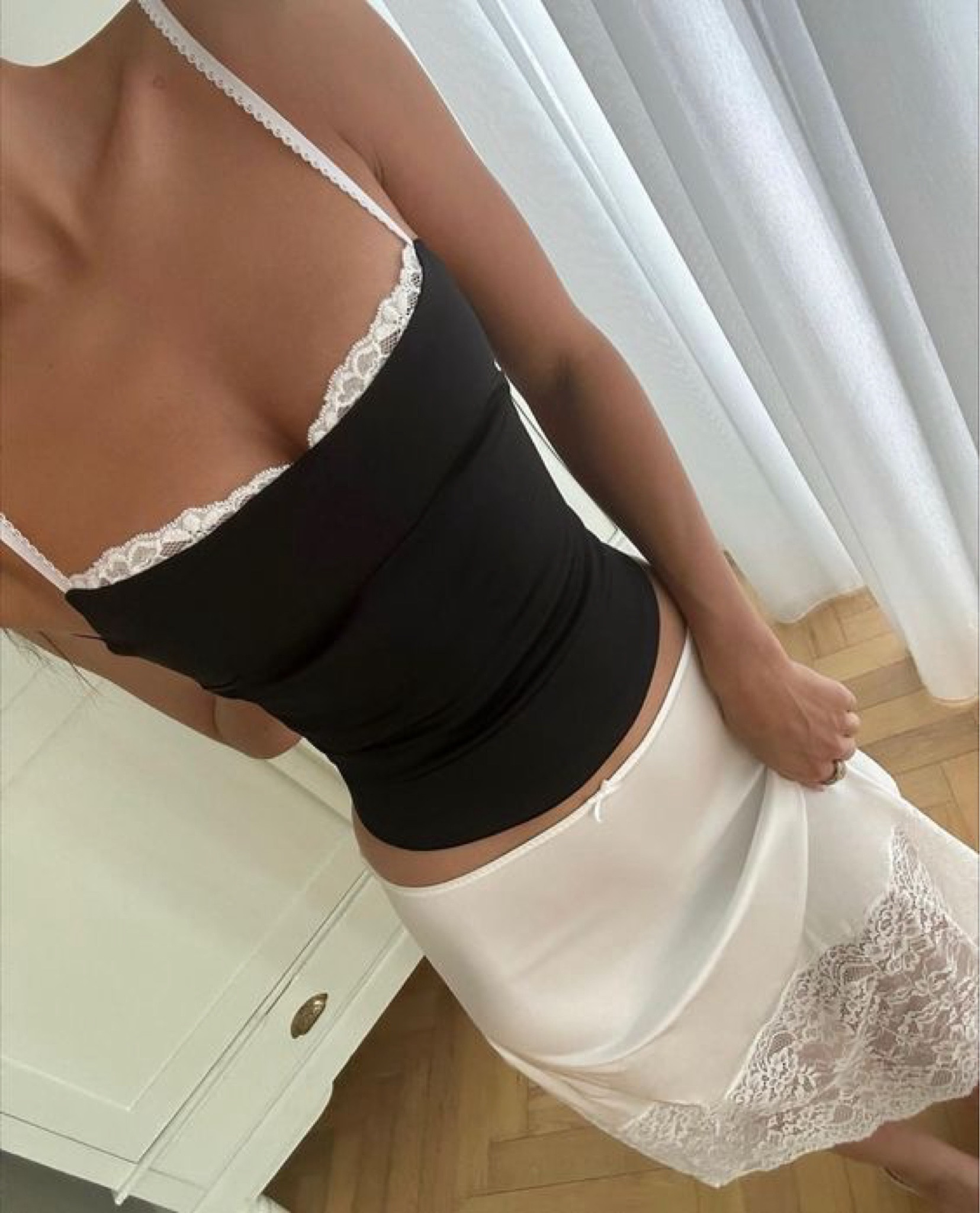 Black and white outfits exude class and elegance 🖤🤍 I love how the white lace peaks through the black tube top, beautiful styling! #weddingguestdress #datenight #summeroutfit

#LTKFestival #LTKstyletip #LTKparties