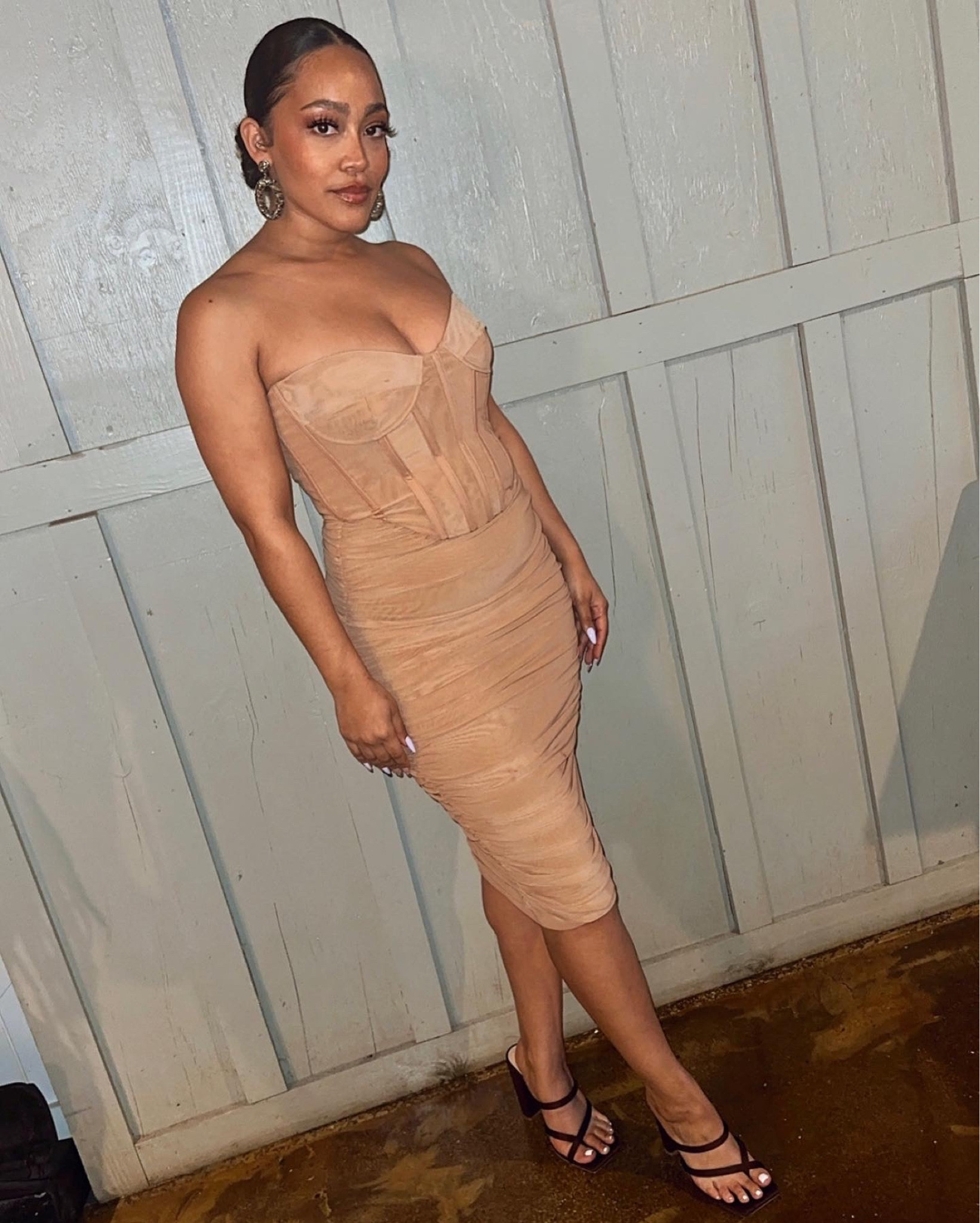 This flesh toned, corset bodice, midi length dress paired with chocolate colored open toe heels was the perfect look for a wedding! 

#LTKwedding