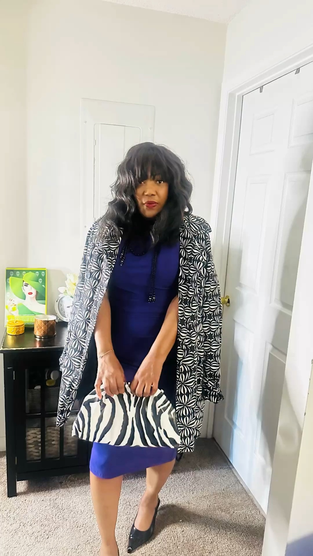 Stepping out in a bold mix of patterns by pairing this timeless black and white paisley coat with a vibrant purple vintage dress. Completed the look with classic slingbacks and a zebra print purse for that perfect touch of effortless, high-fashion contrast.

#LTKstorytime #LTKgrwm #LTKOver40