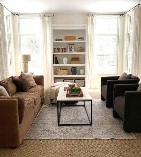 Living room, white cotton curtains, neutral rug, sea grass rug, modern coffee table, ceramic vases, organic modern.

#LTKfindsunder100 #LTKfindsunder50 #LTKhome