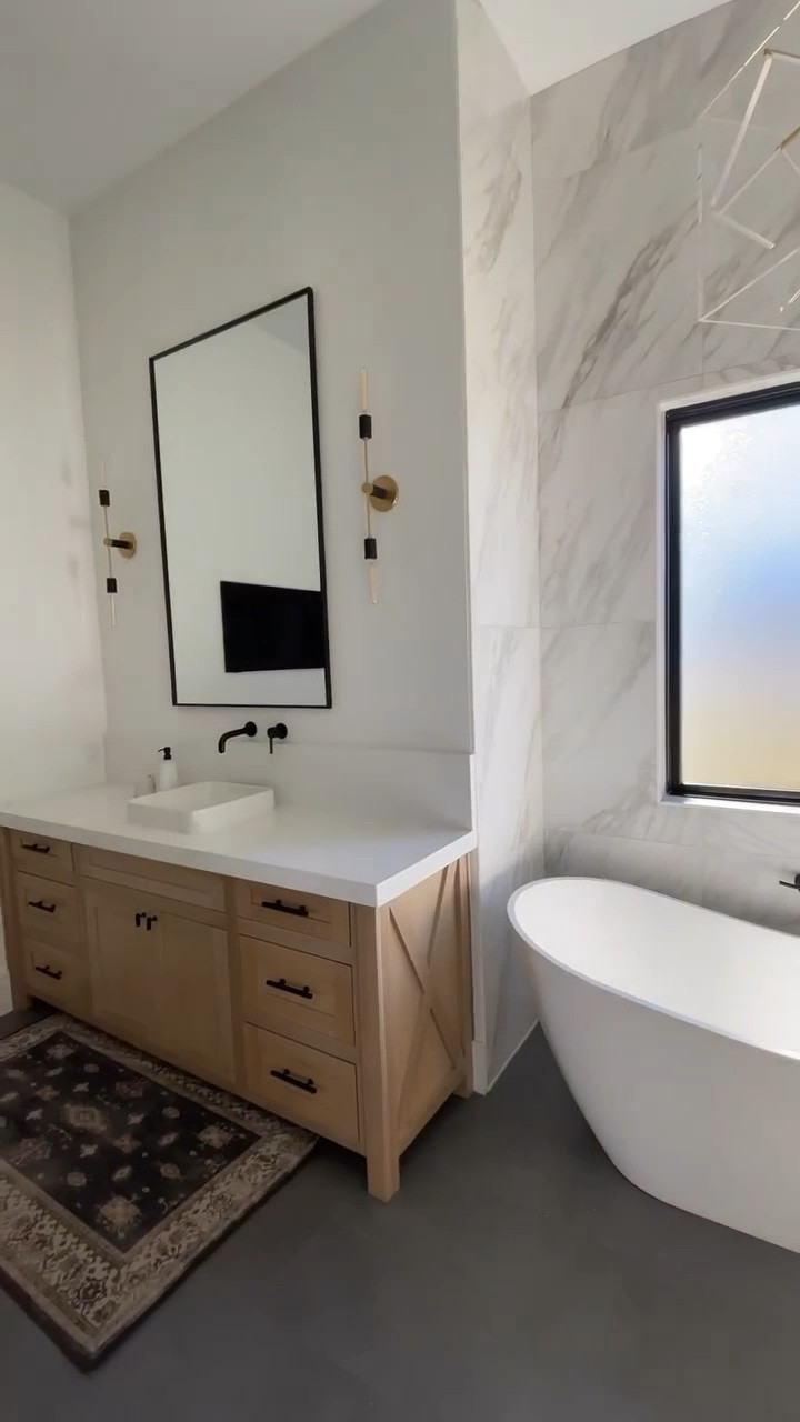 Modern, airy bathroom with tall mirrors and sconces.

#LTKhome #LTKsalealert #LTKFind